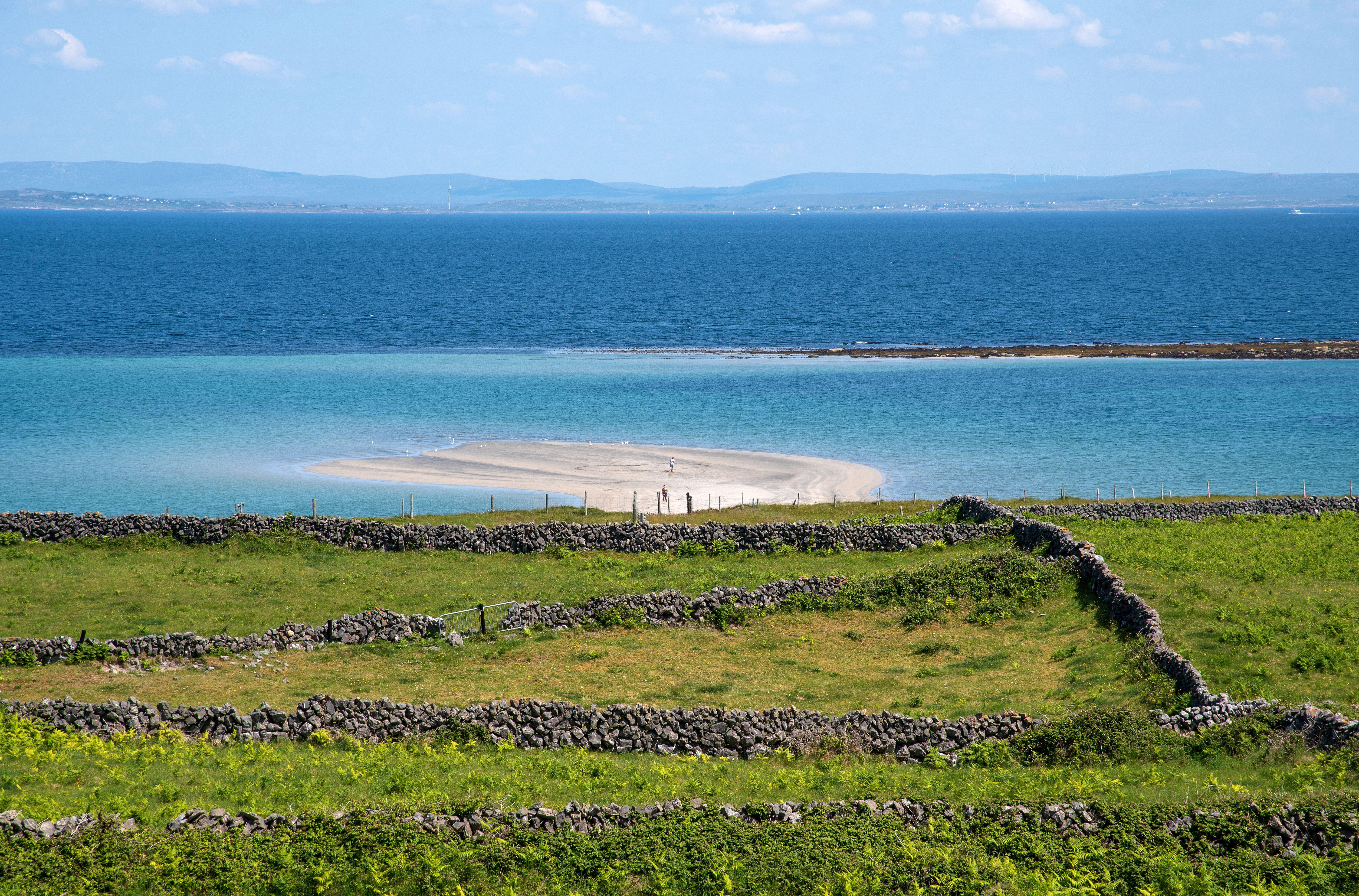 Tra Mor beach with large sand dunes with crystal clear waters, Inishmore, Aran Island, Ireland