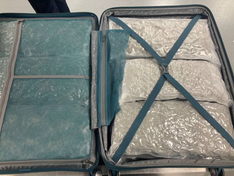 Cannabis wrapped in plastic and packed into a suitcase.