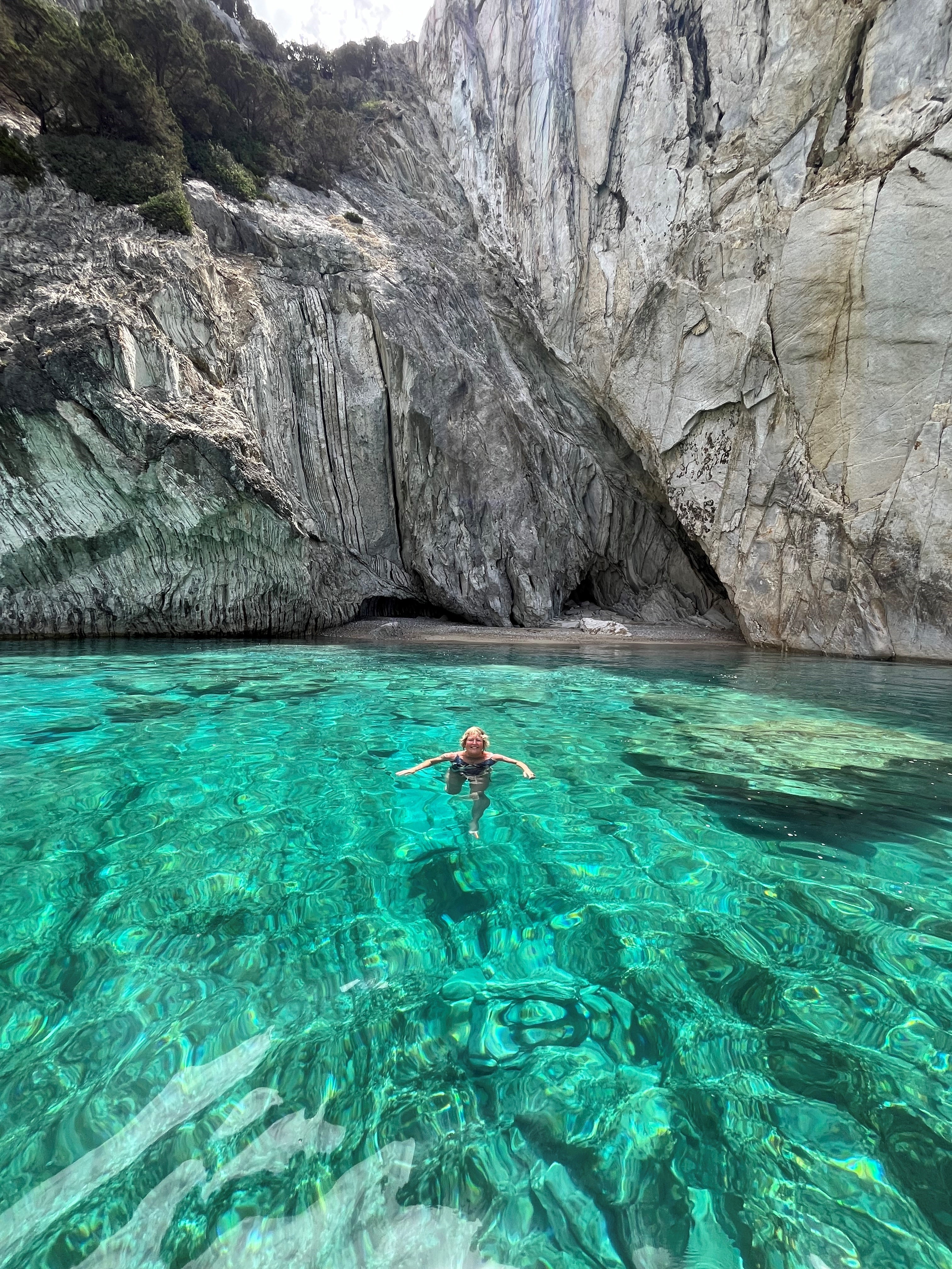 Hannah Stephenson swims from the boat off Meganisi (Hannah Stephenson/PA)