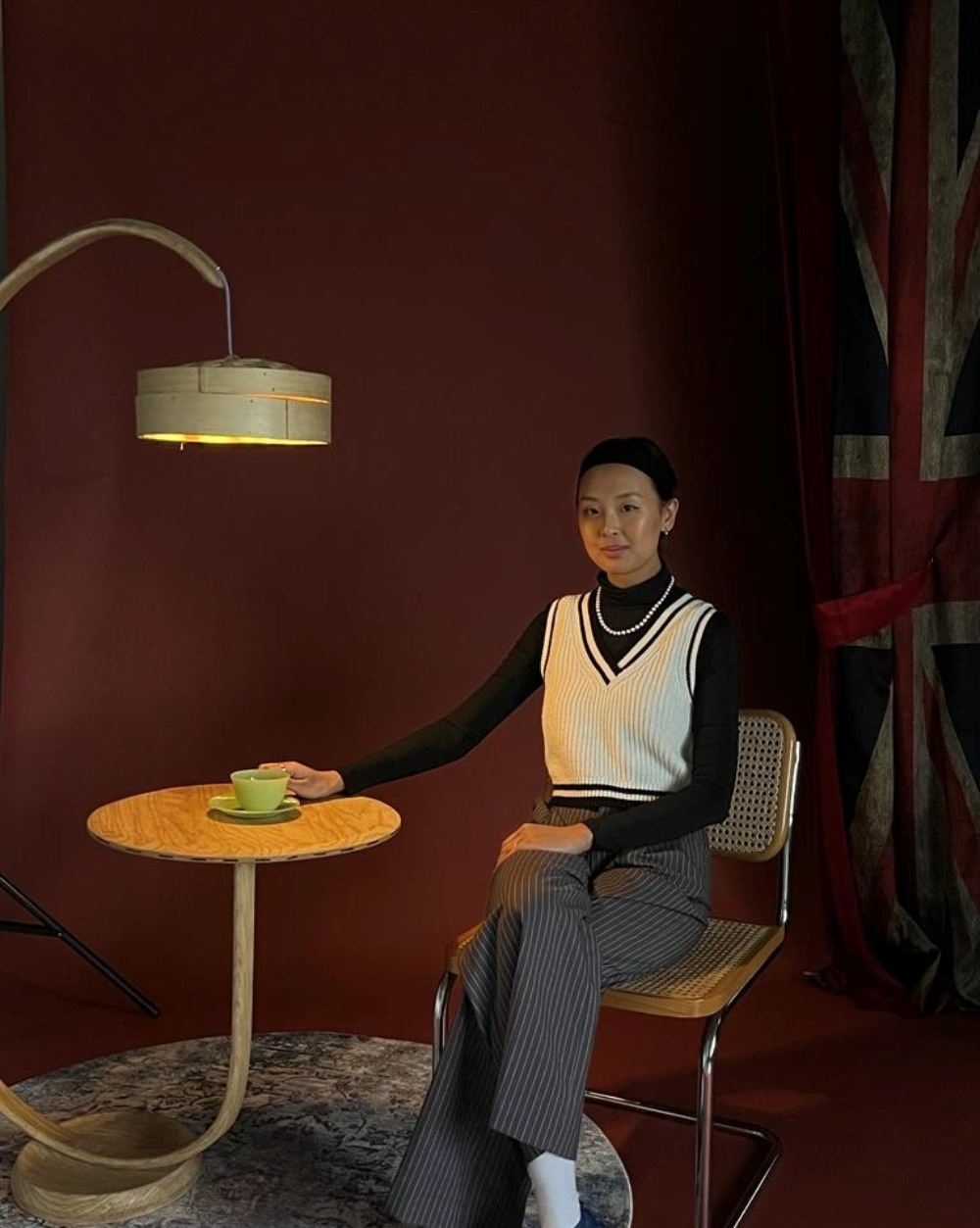 Woman sat at a desk with a lamp