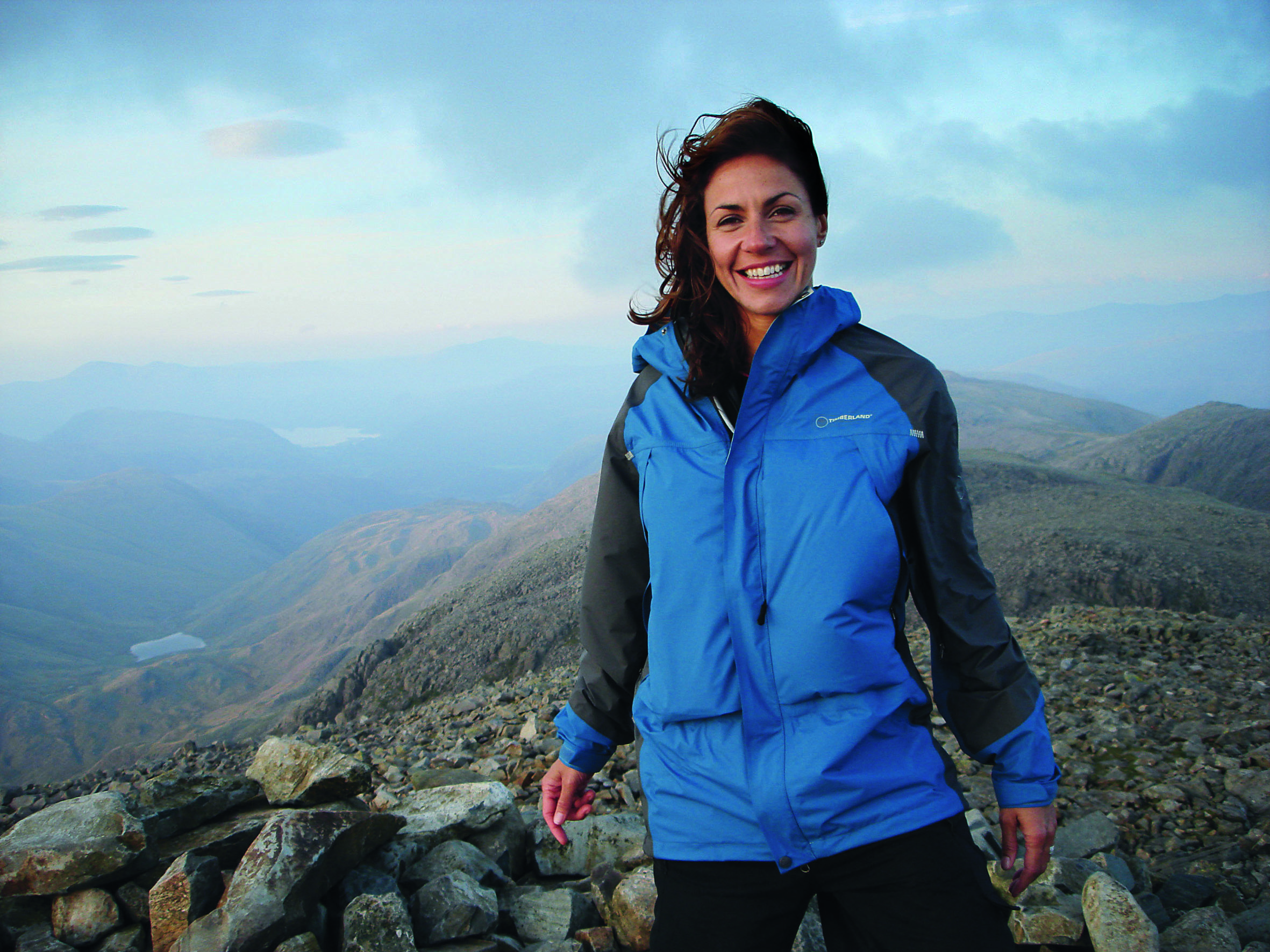 Julia Bradbury stands on mountain summit