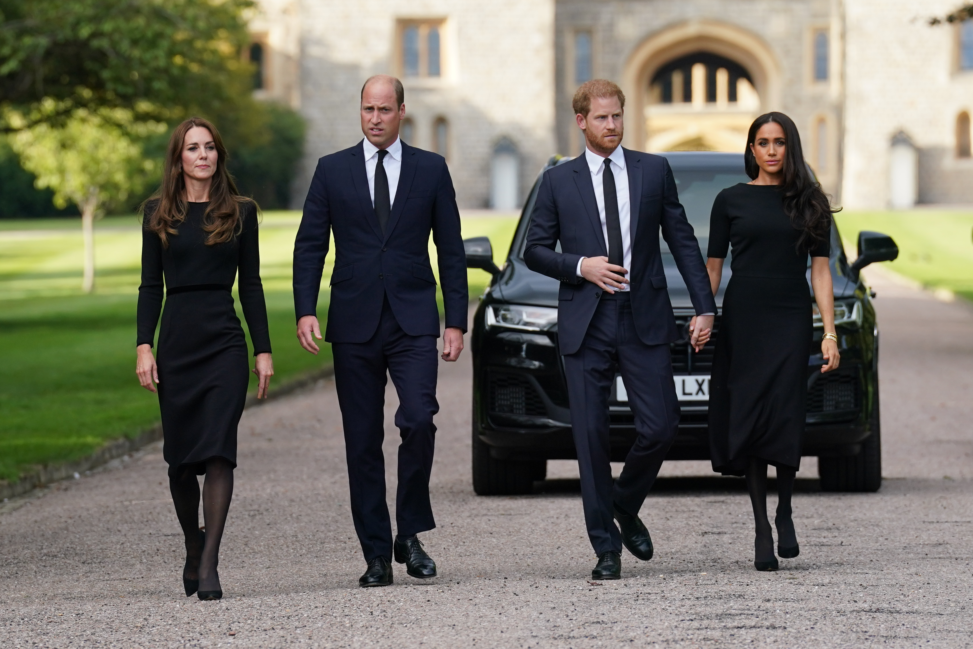 The Princess of Wales, the Prince of Wales and the Duke and Duchess of Sussex walk to meet members of the public at Windsor Castle following the death of Queen Elizabeth II 