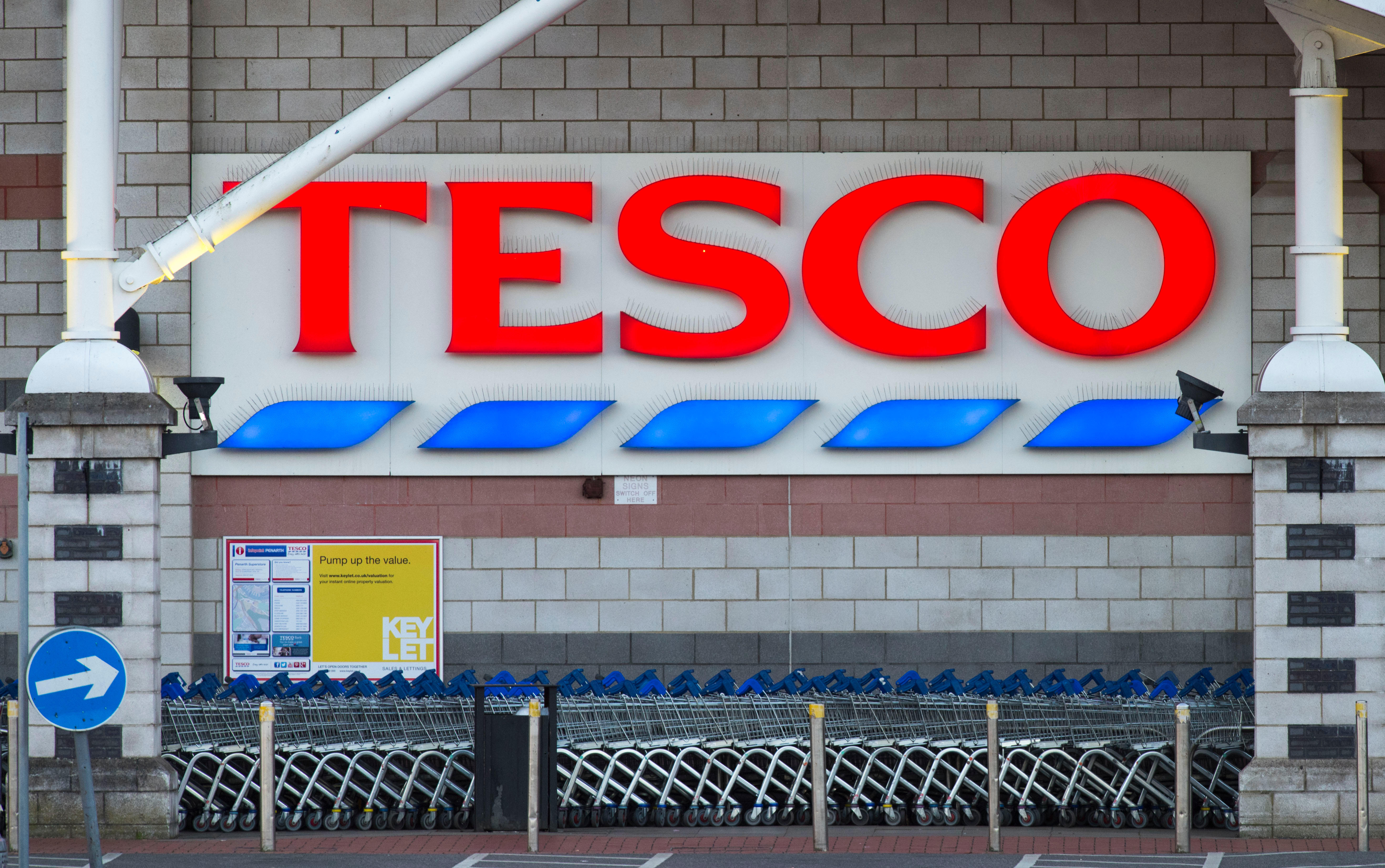 A Tesco sign outside a supermarket