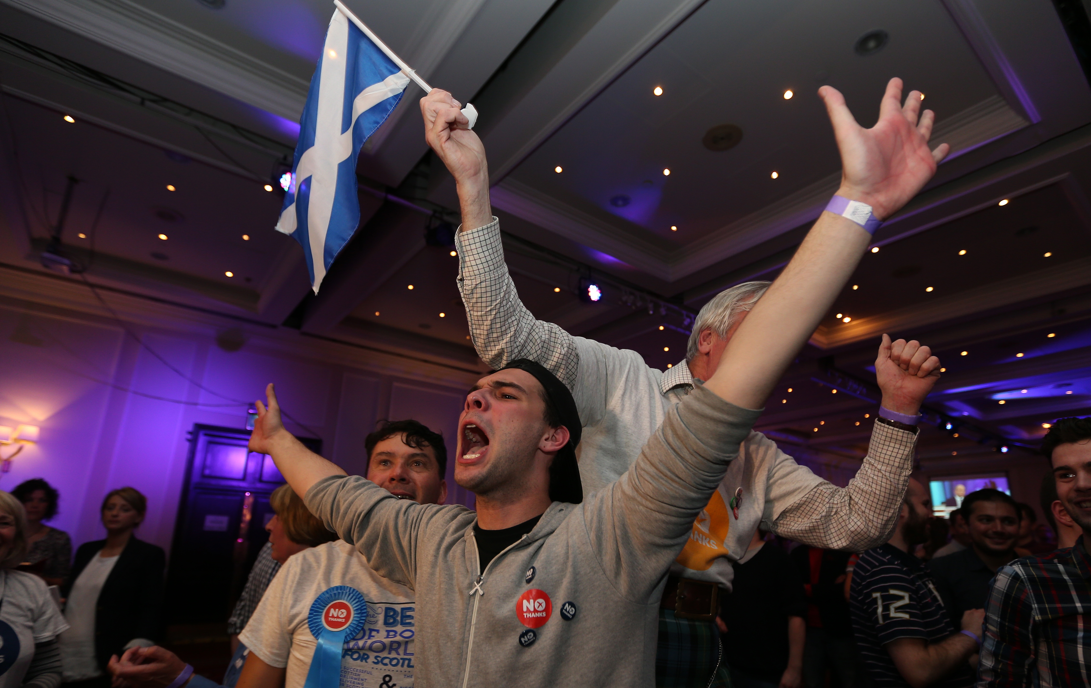 People with arms raised in celebration