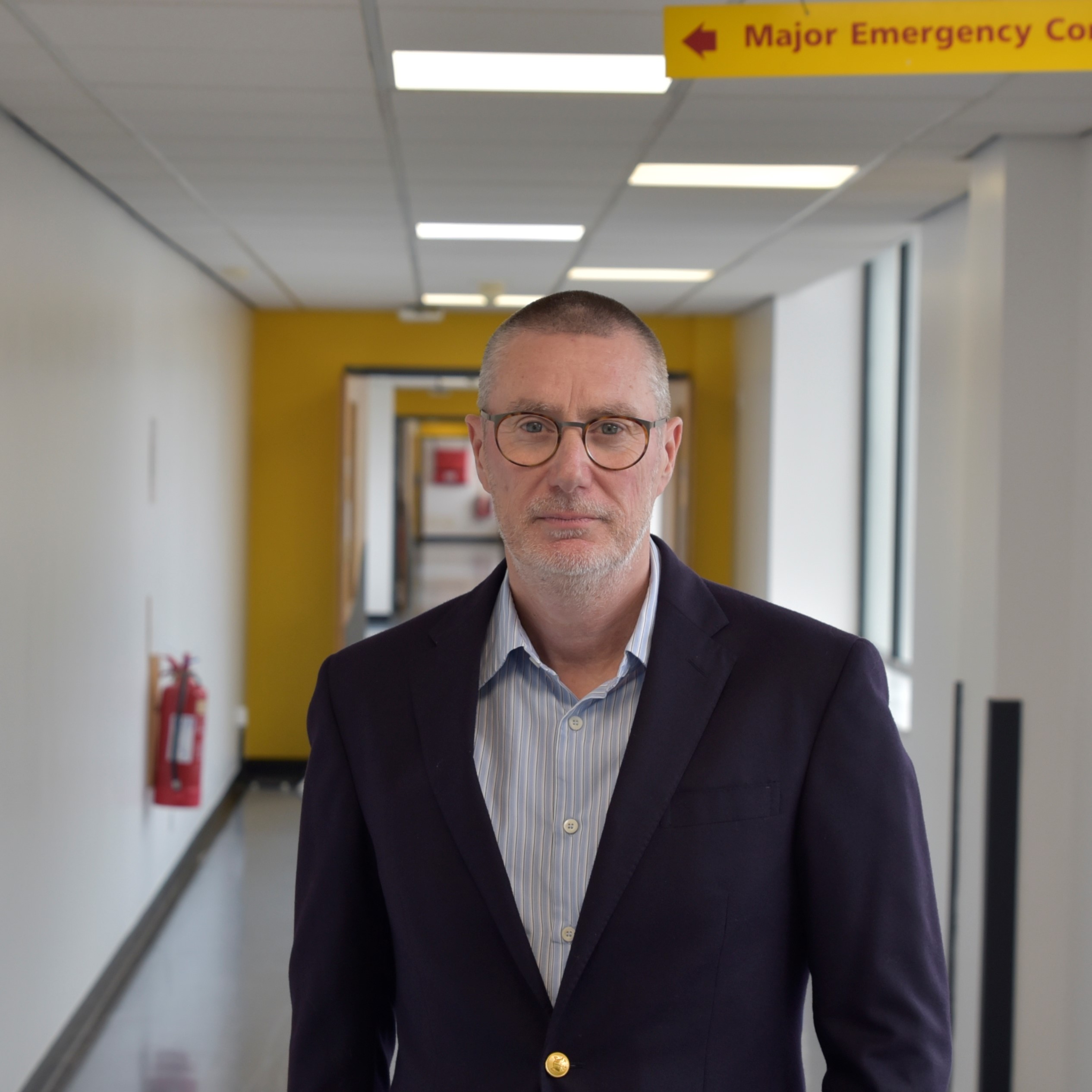 Anthony May in a hospital corridor