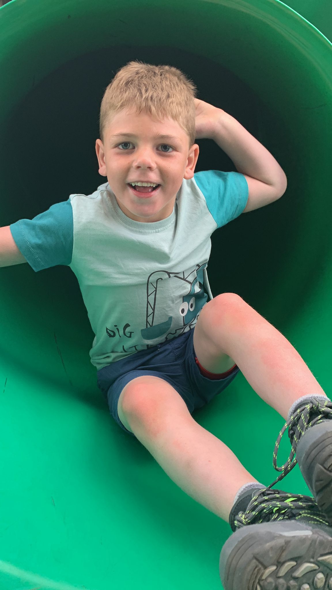 Boy posing with hand behind head 