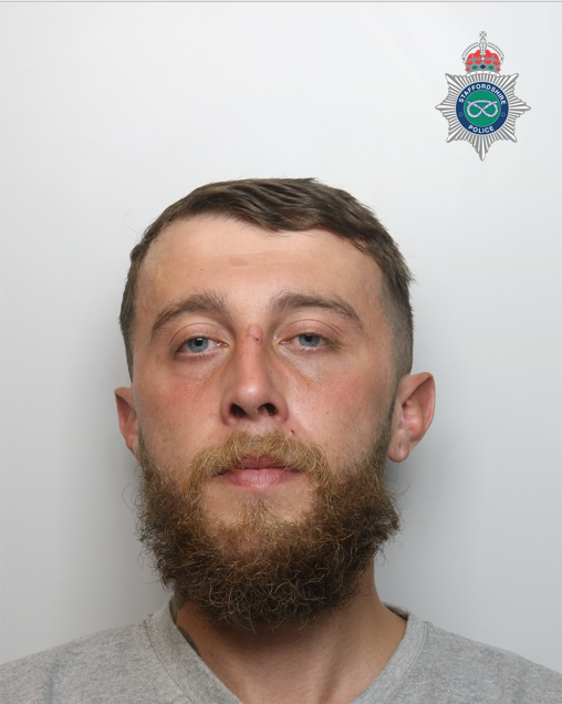 Head shot of a man with a beard