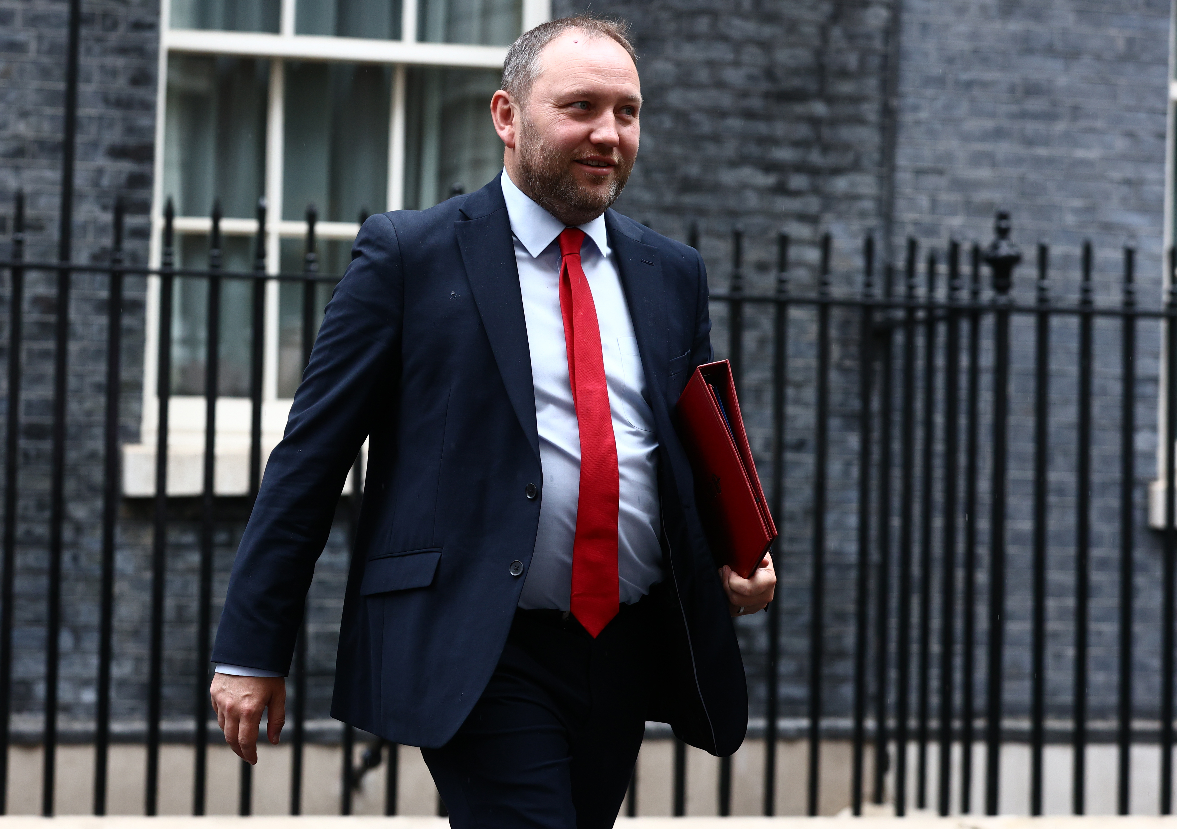 Ian Murray on Downing Street, with Cabinet portfolio under his arm