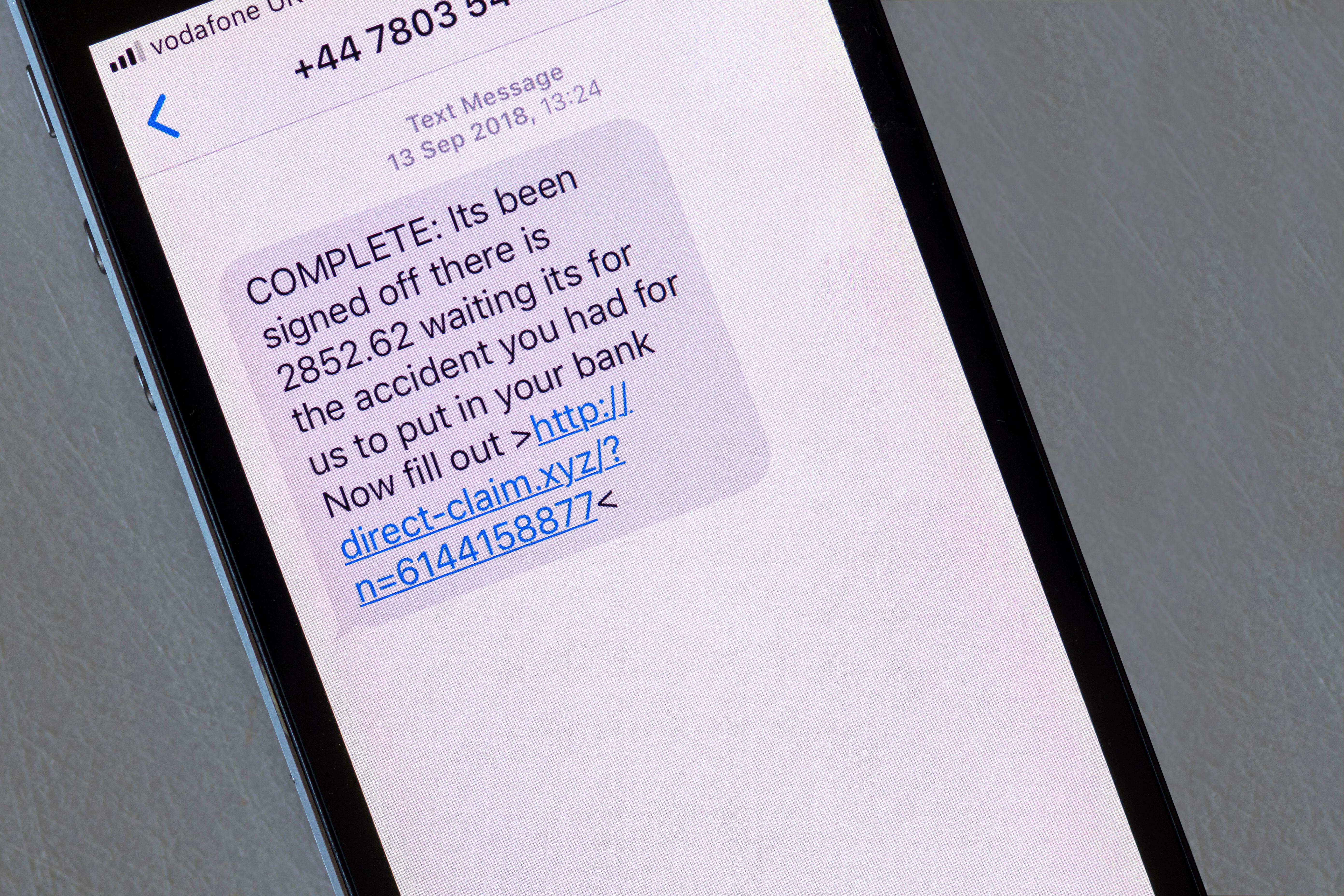 A scam message displayed on an iphone that pretends to be about payment from an insurance claim.