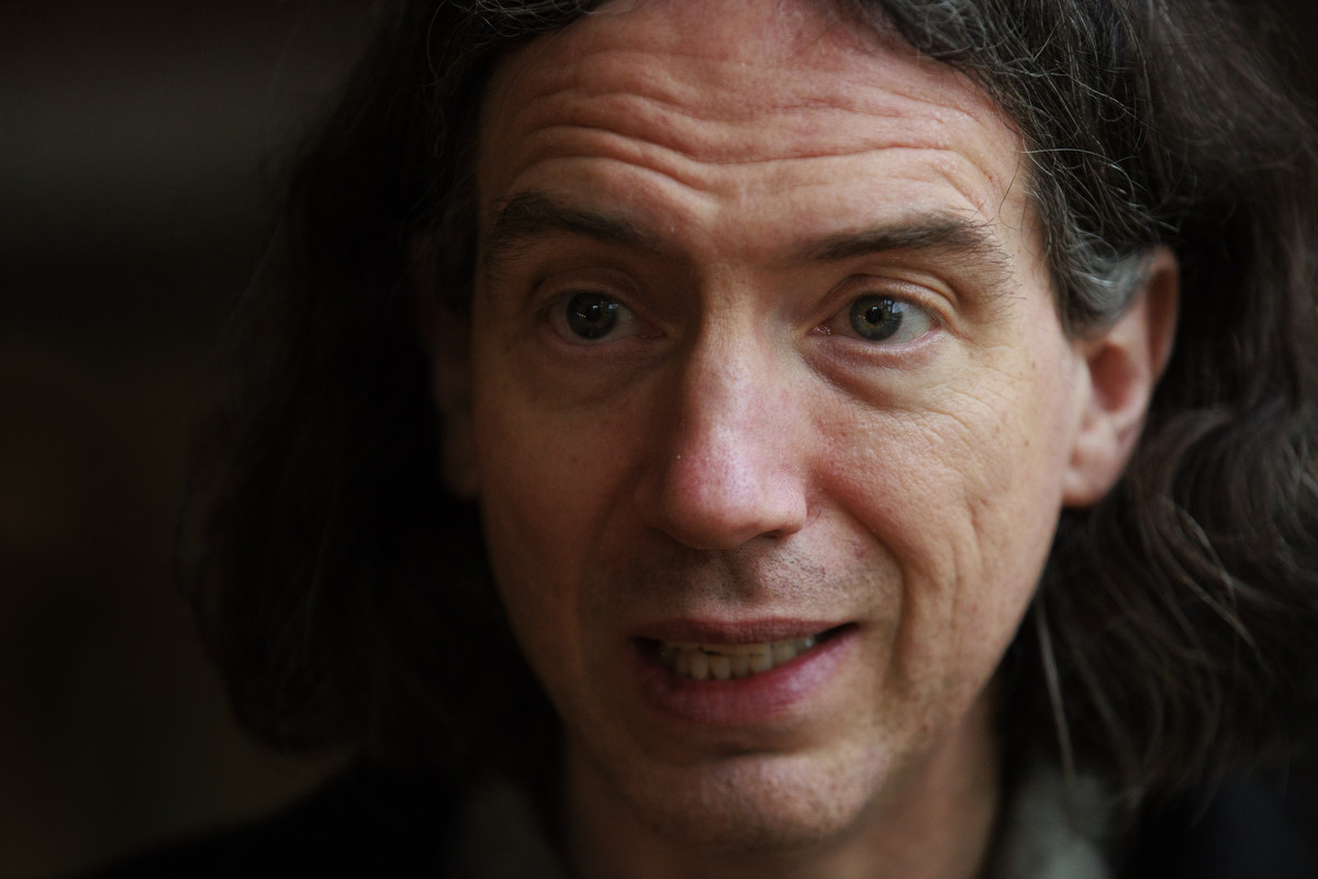 Head shot of a man with dark hair