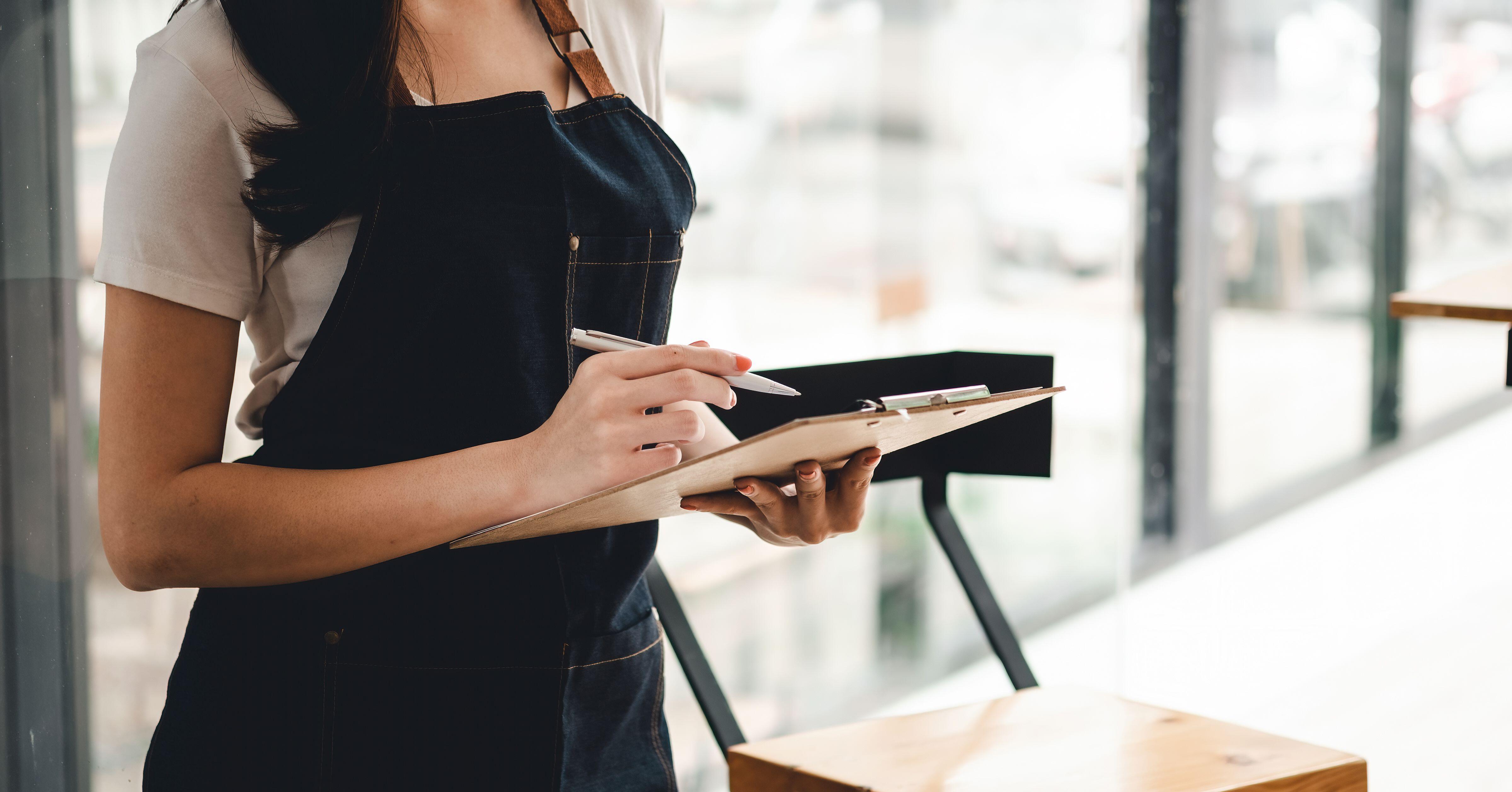 Close up of a waitress taking an order