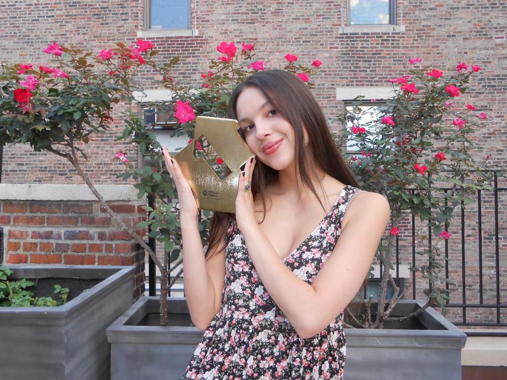 Olivia Rodrigo in a floral dress