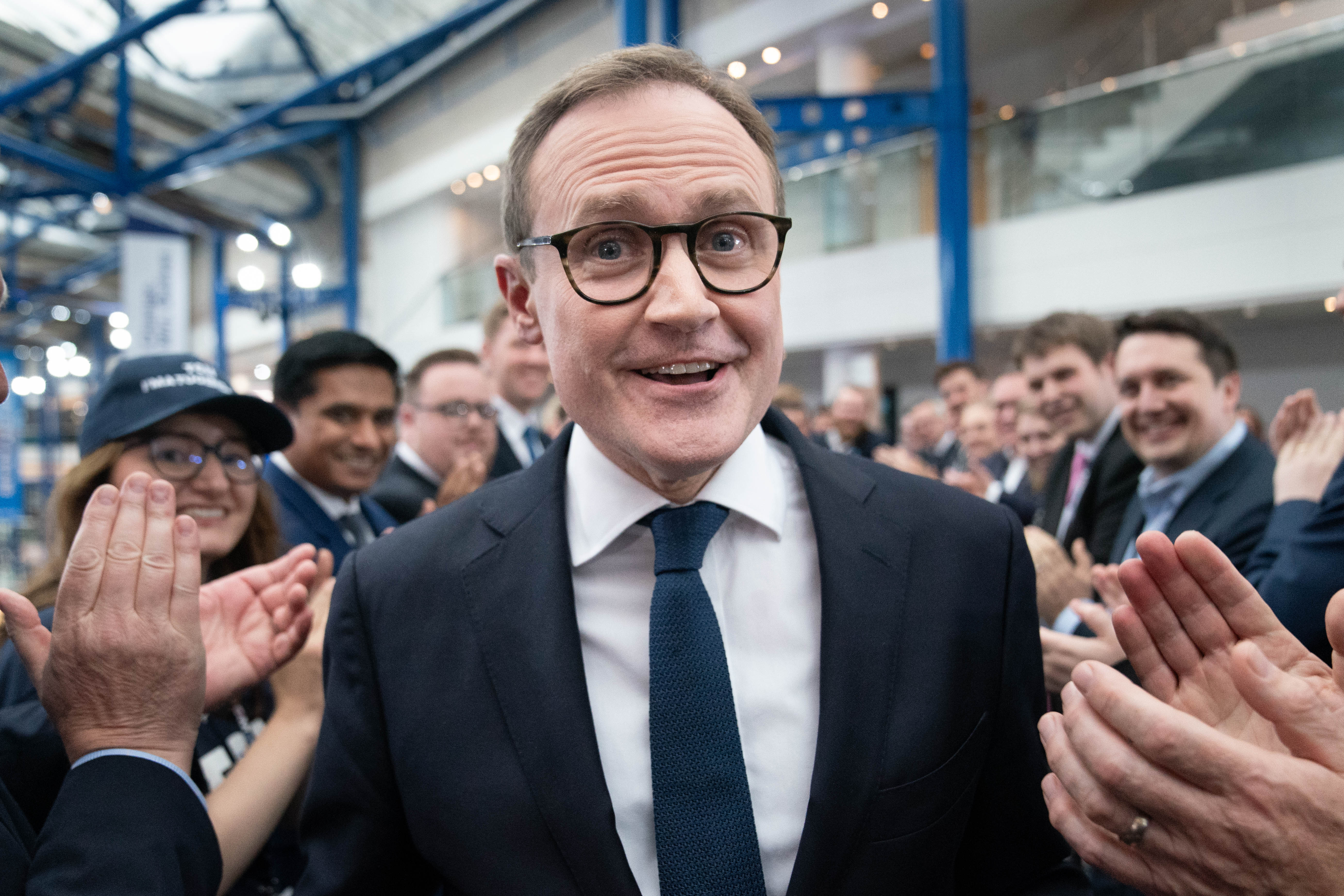 Tory leadership candidate, Tom Tugendhat walks past supporters after attending a hustings event during the Conservative Party Conference 