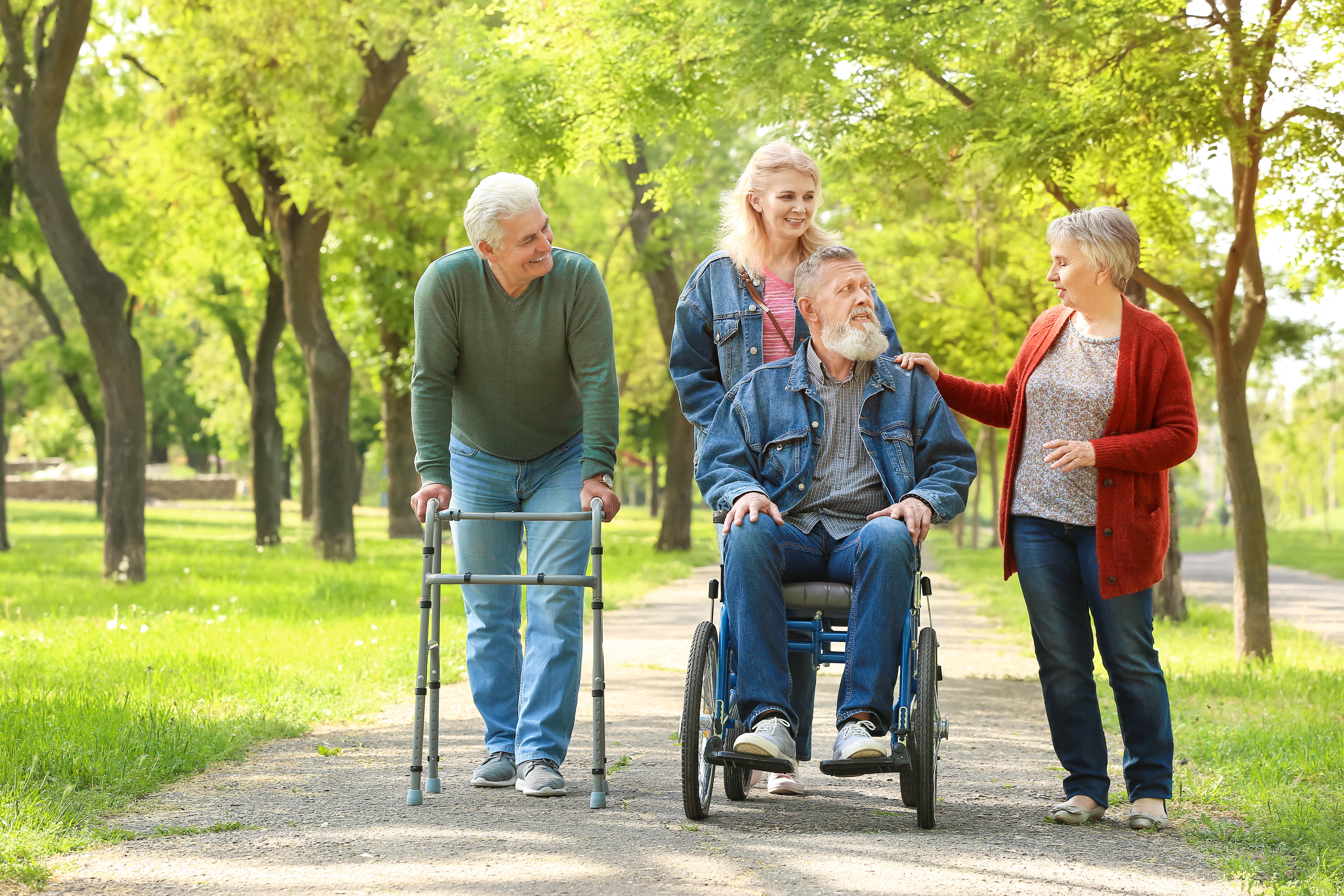 A group of senior people walking in a park