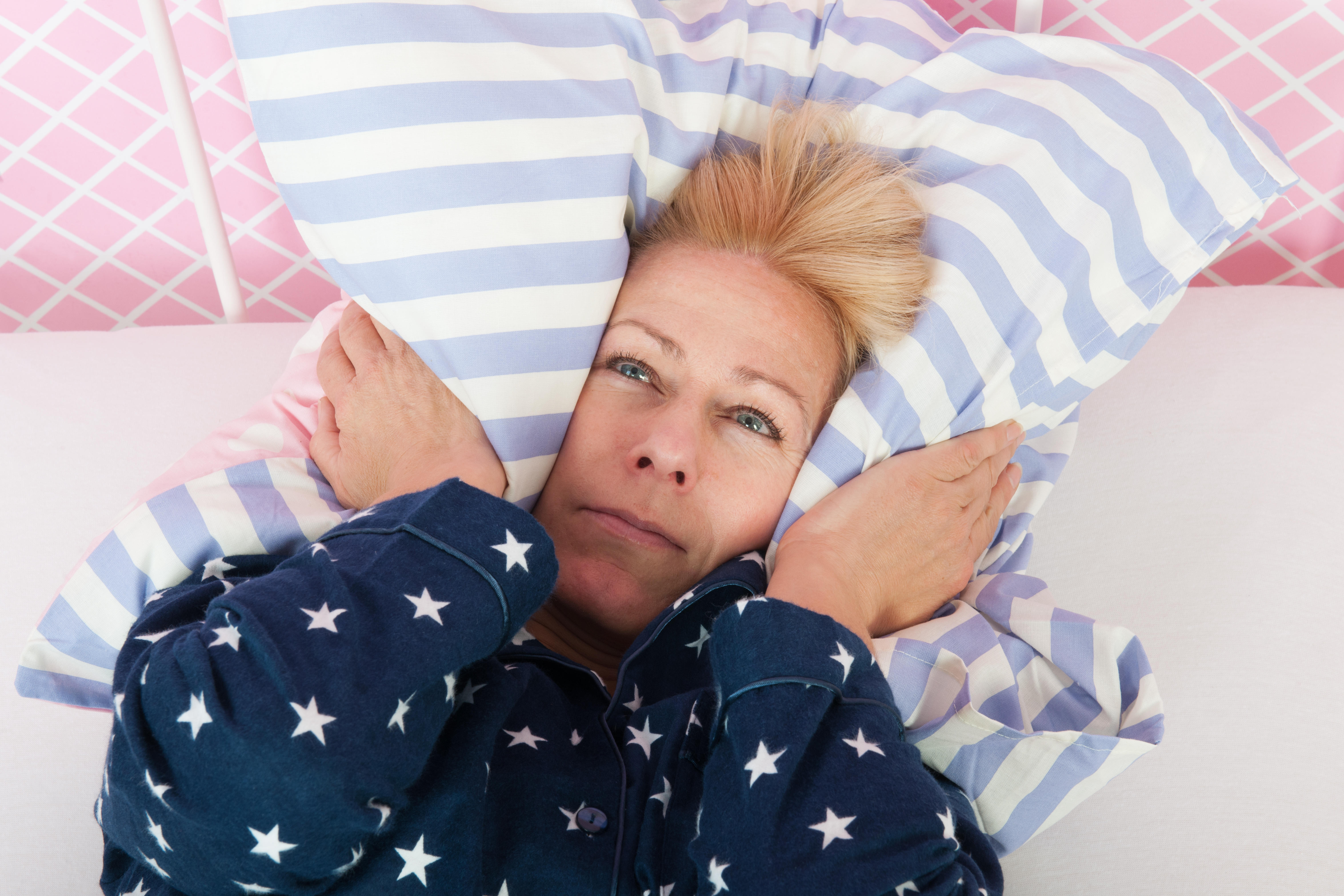 Blonde mature woman struggling to get to sleep