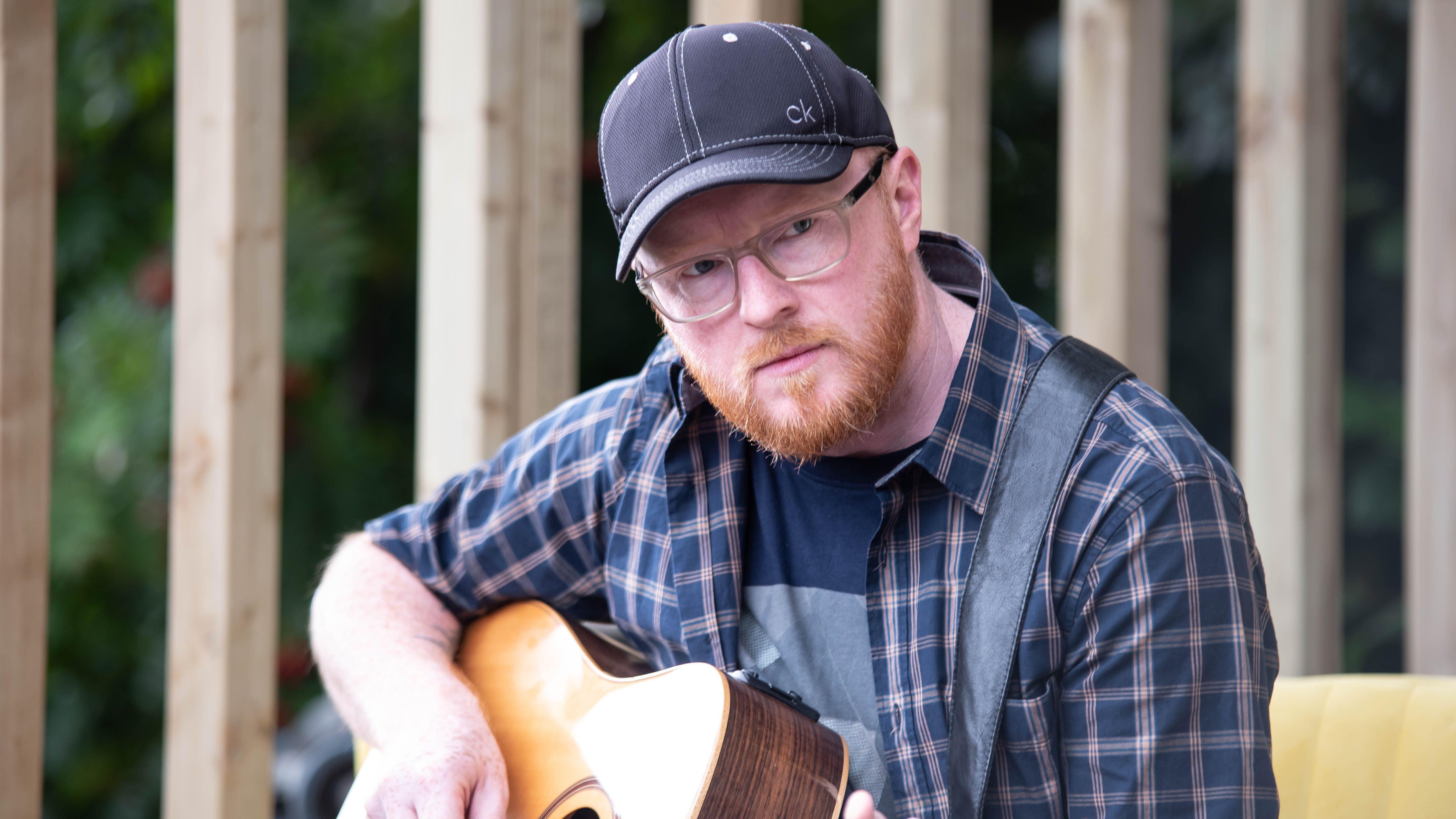 Singer playing guitar