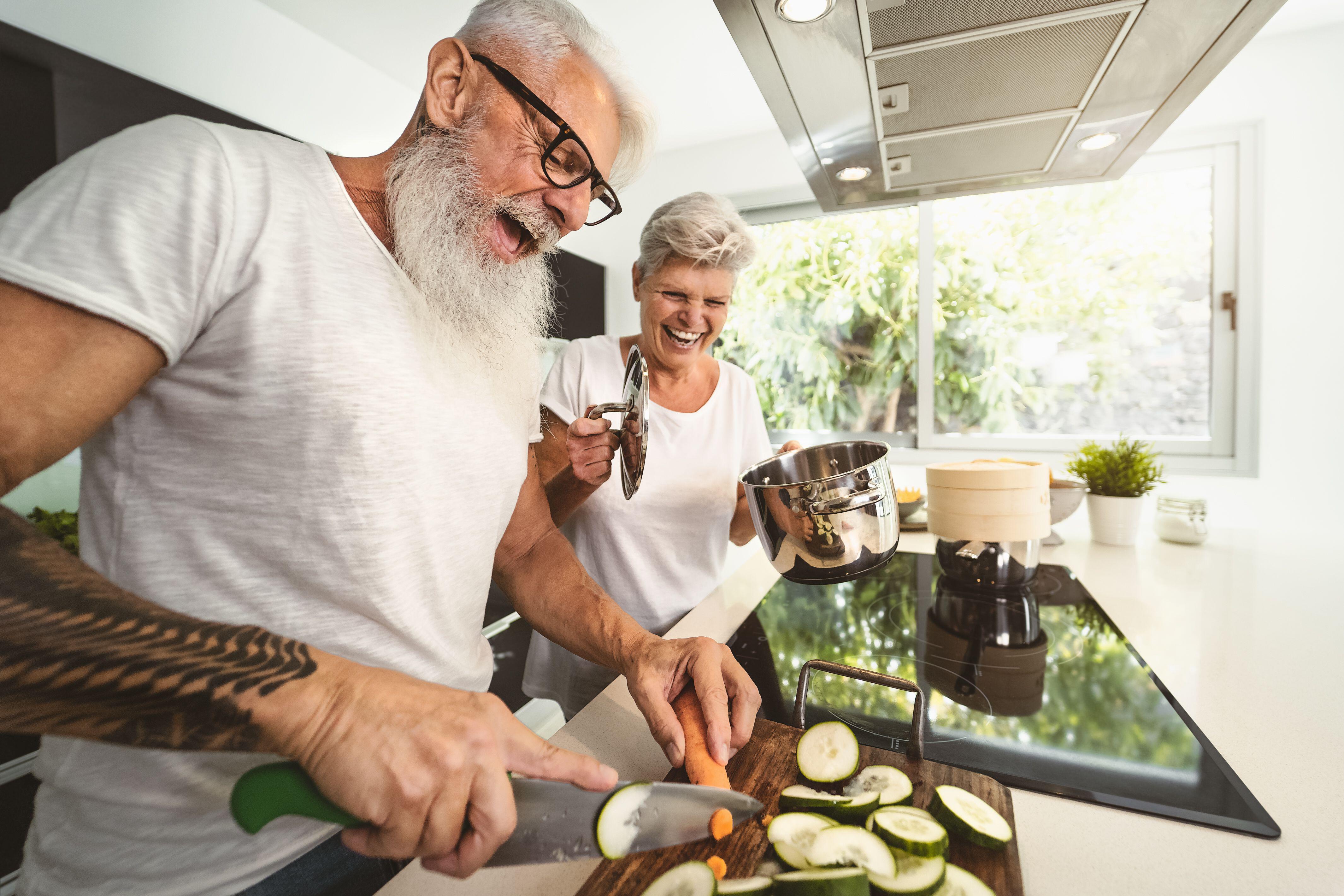 A couple cooking dinner