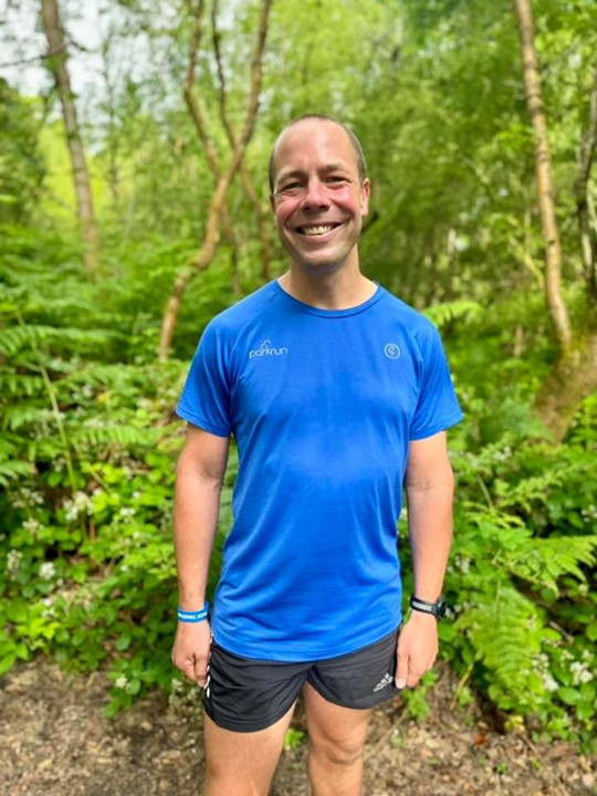 Darren Wood wearing a parkrun T-shirt at Banstead Woods