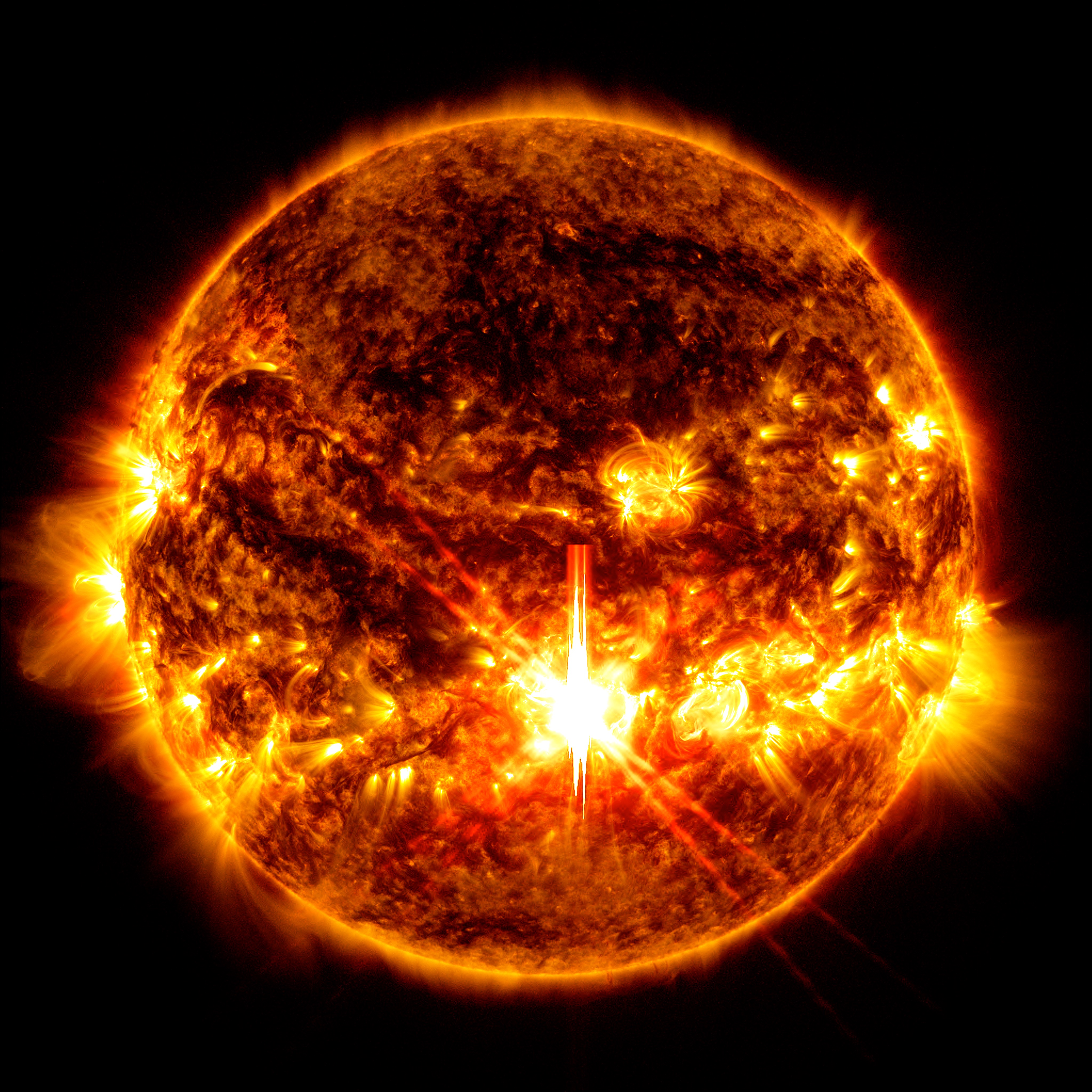 Image of an X9.0 solar flare – as seen in the bright orange flash in the centre of the sun