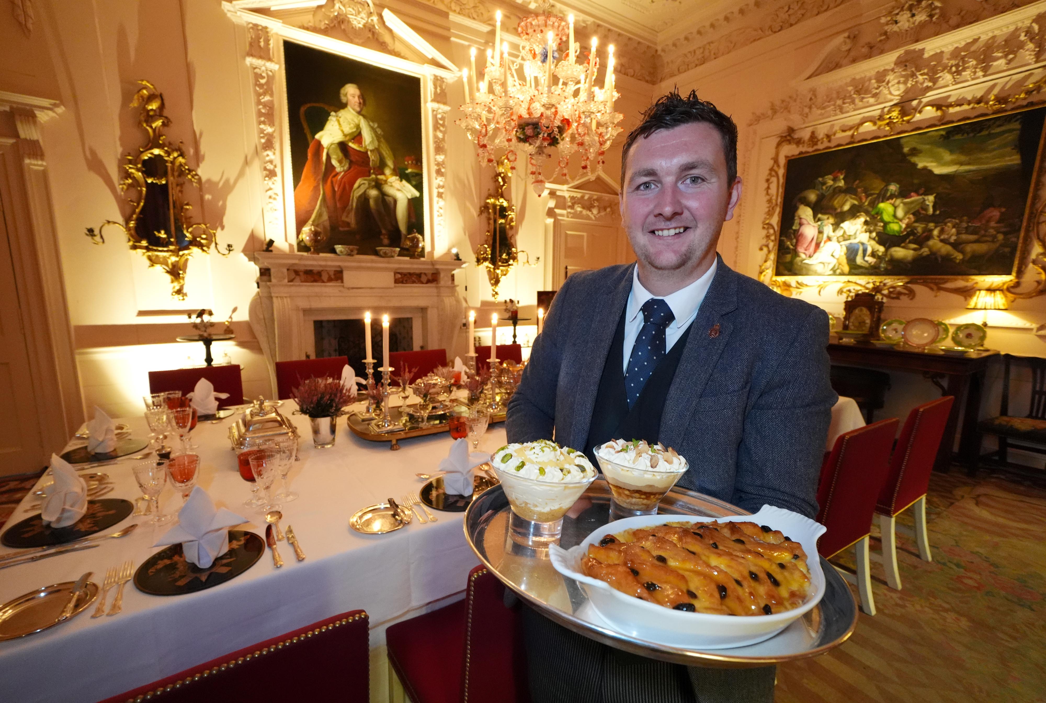 Evan Samson, who leads the front of house team, with a lemon and pistachio syllabub, bread and butter pudding alongside an apple and almond trifle in the Pink Dining Room 