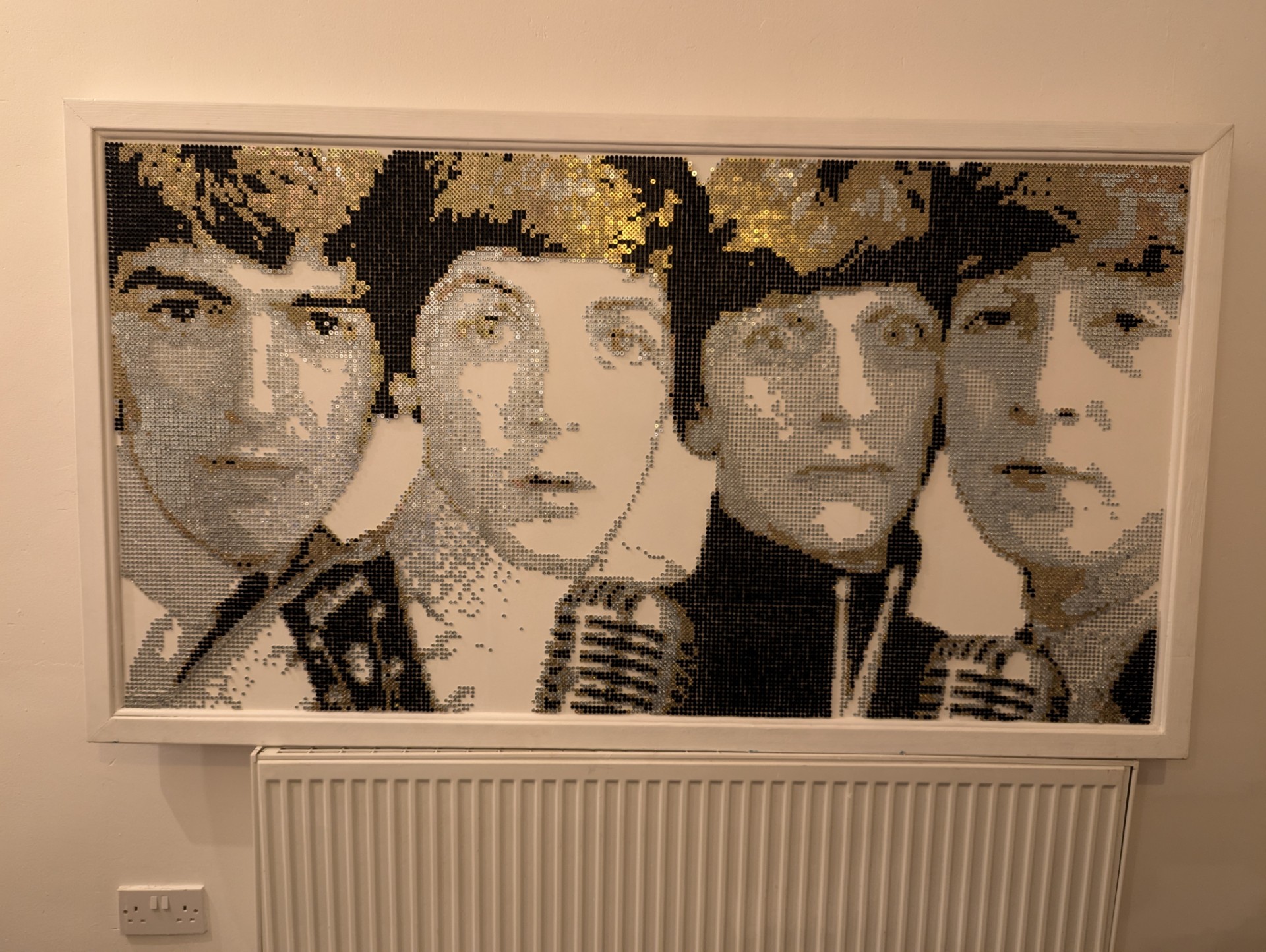 A Beatles artwork made using screws 