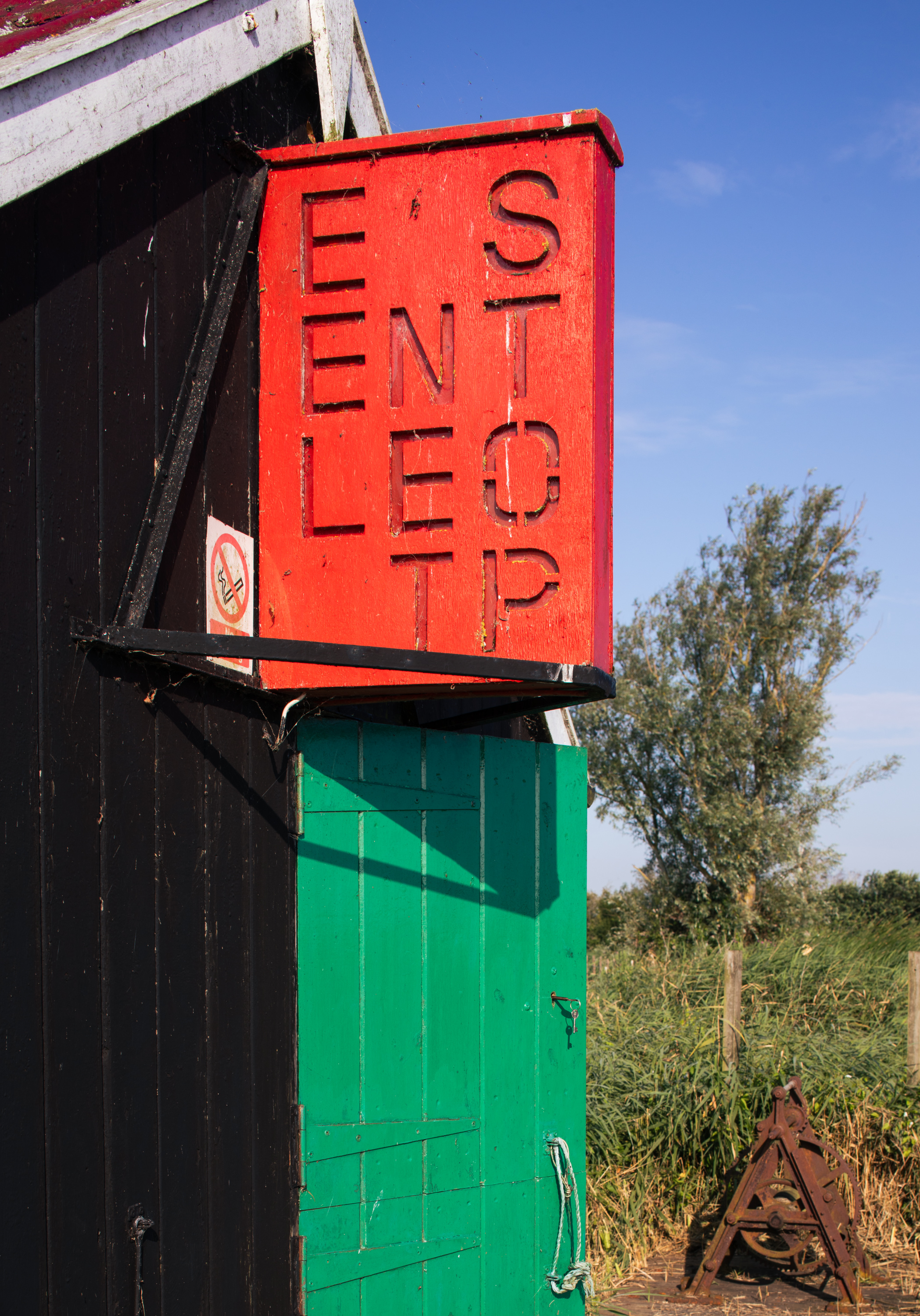 A red 'eel net stop' sign at the Eel Sett 