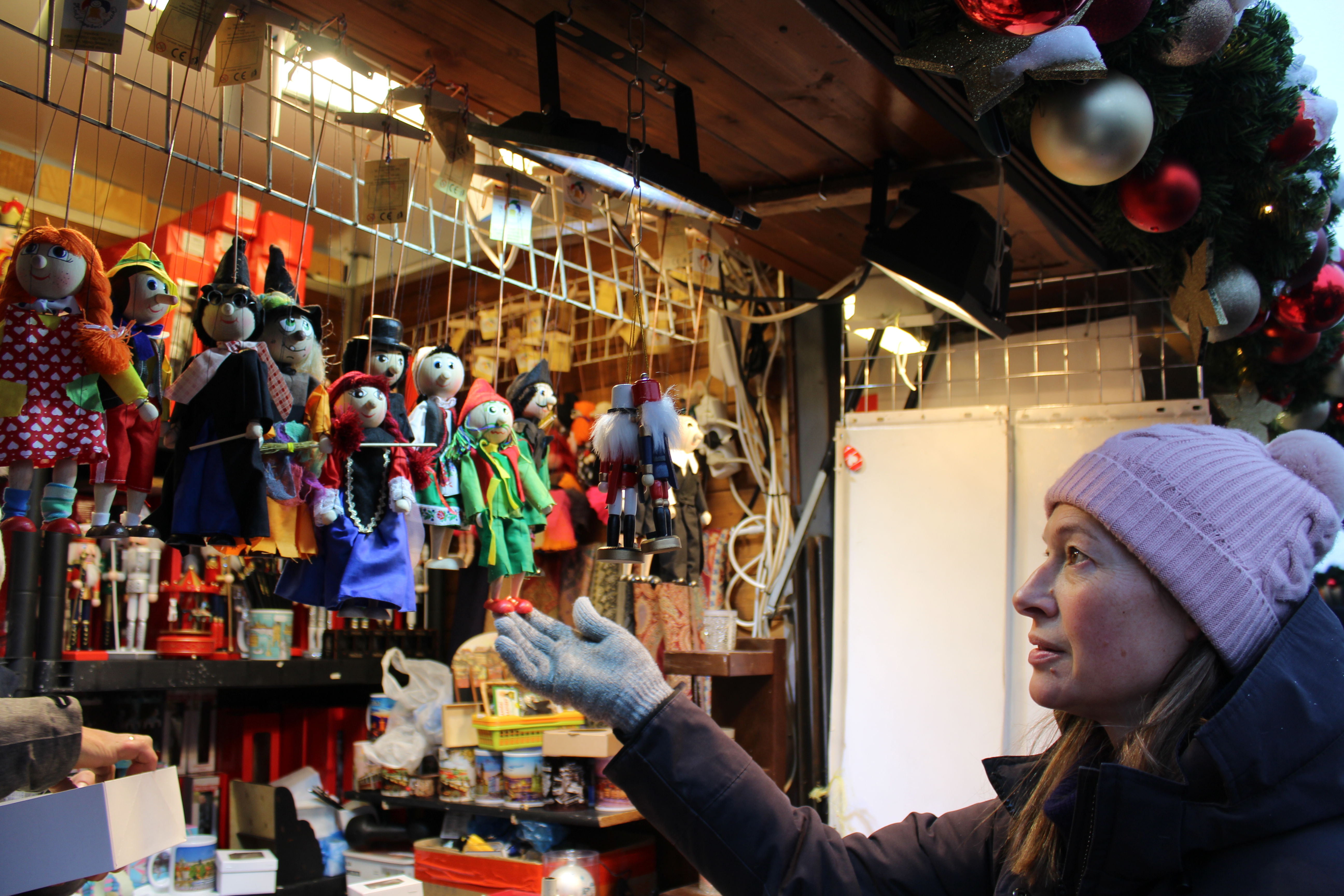 Choosing hand-made marionette puppets at the Old Town Square Christmas market in Prague. (Josie Clarke/PA)