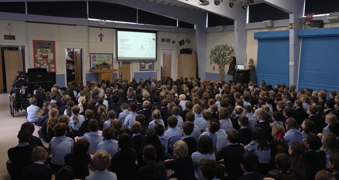 Pupils watch a hand-washing lesson