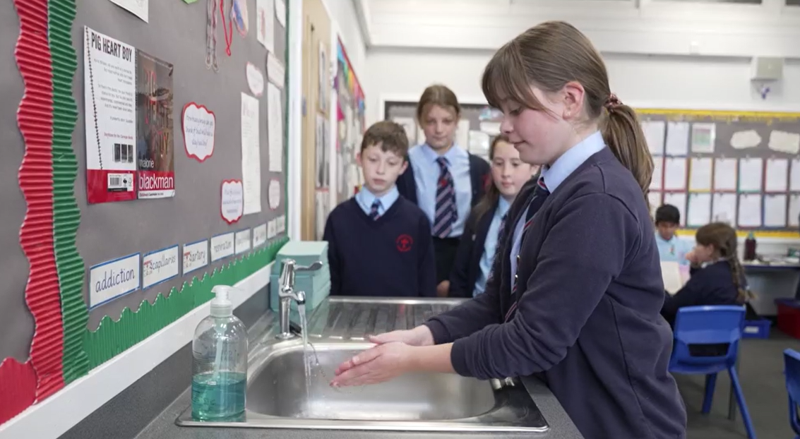 Children washing their hands