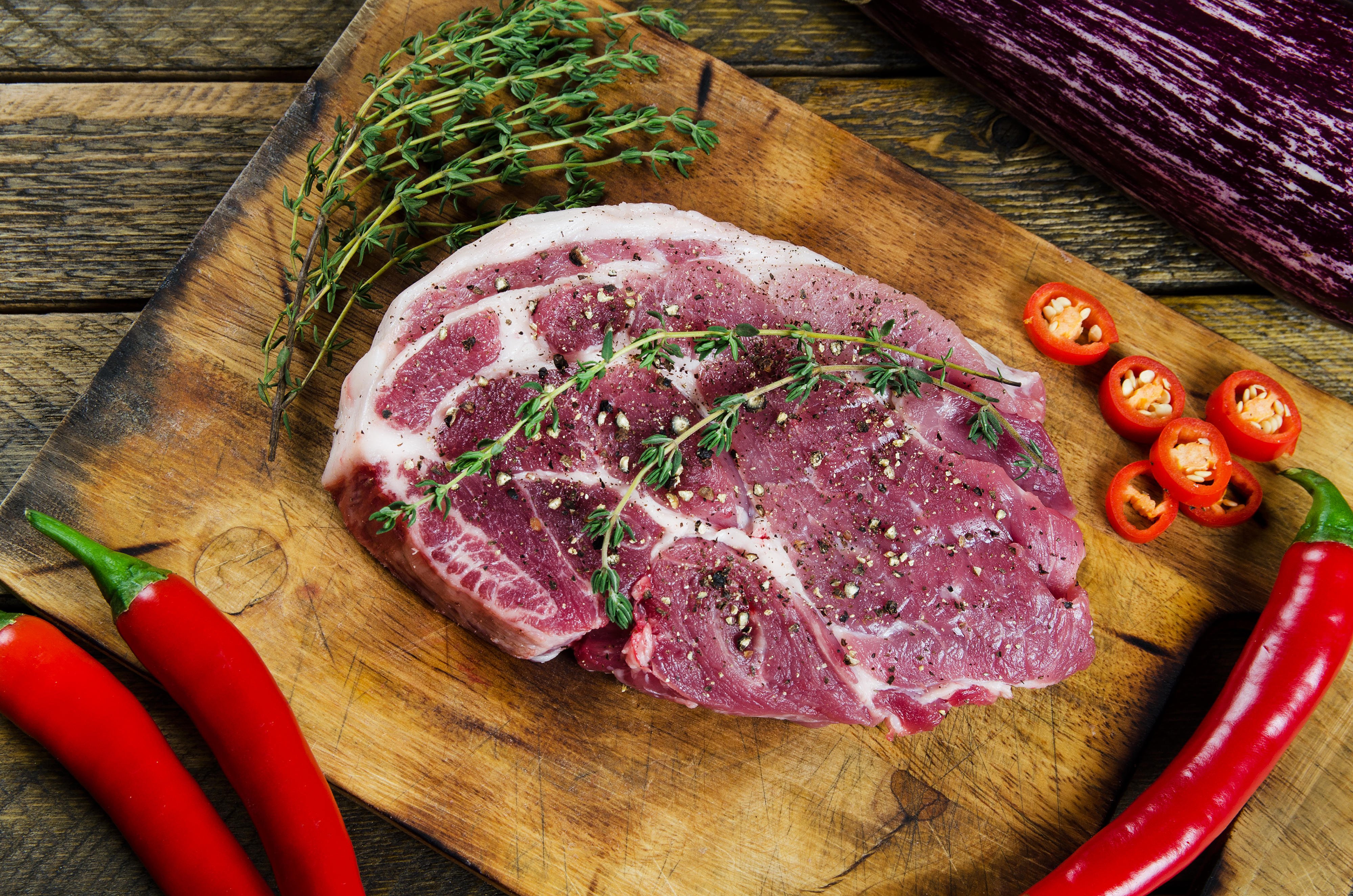 Cooking steak with thyme and chilli.