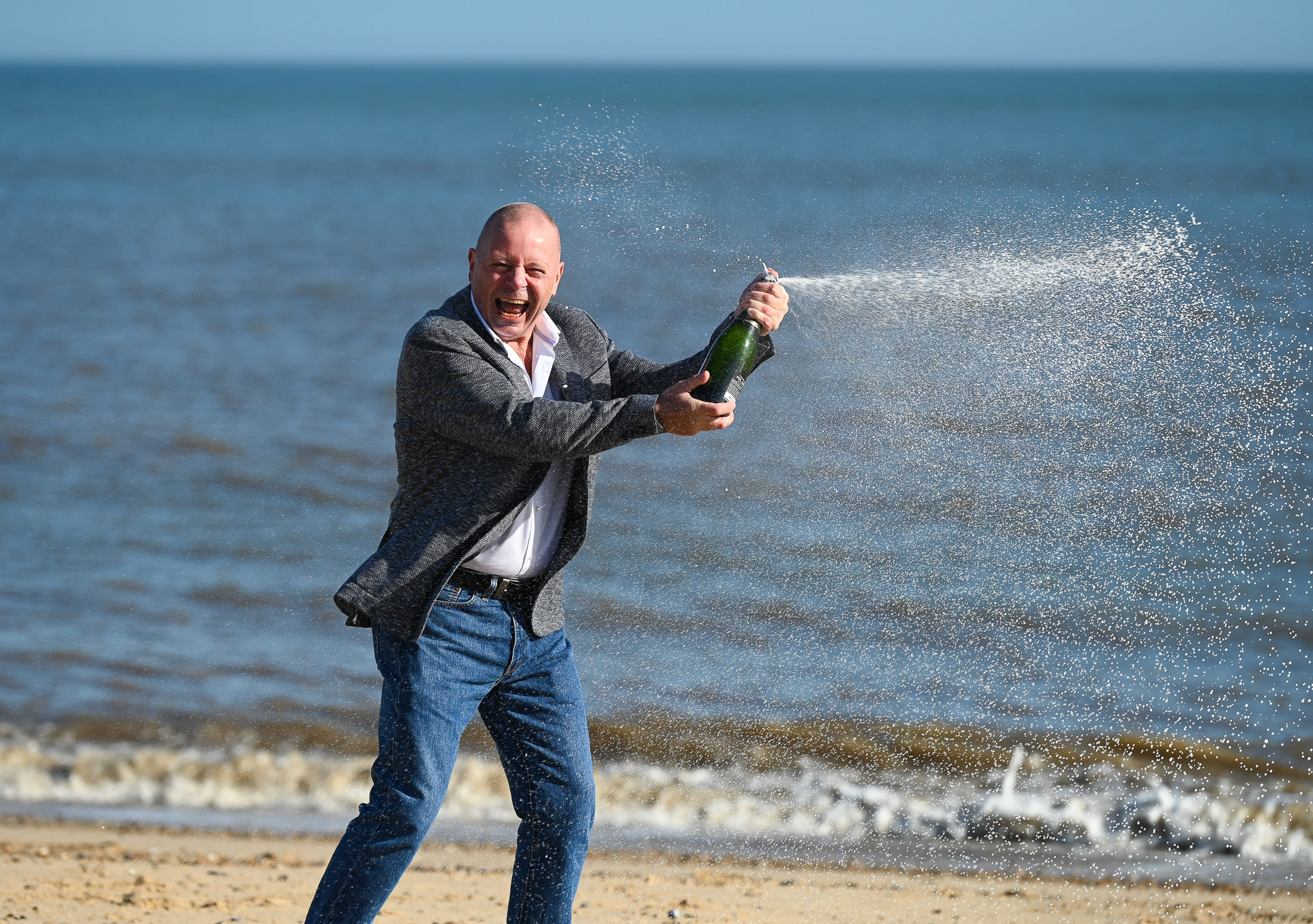 IT worker John Lingard, 66, of Great Yarmouth, celebrates his £500,000 lottery win a year after he had cancer surgery. (National Lottery/ PA)