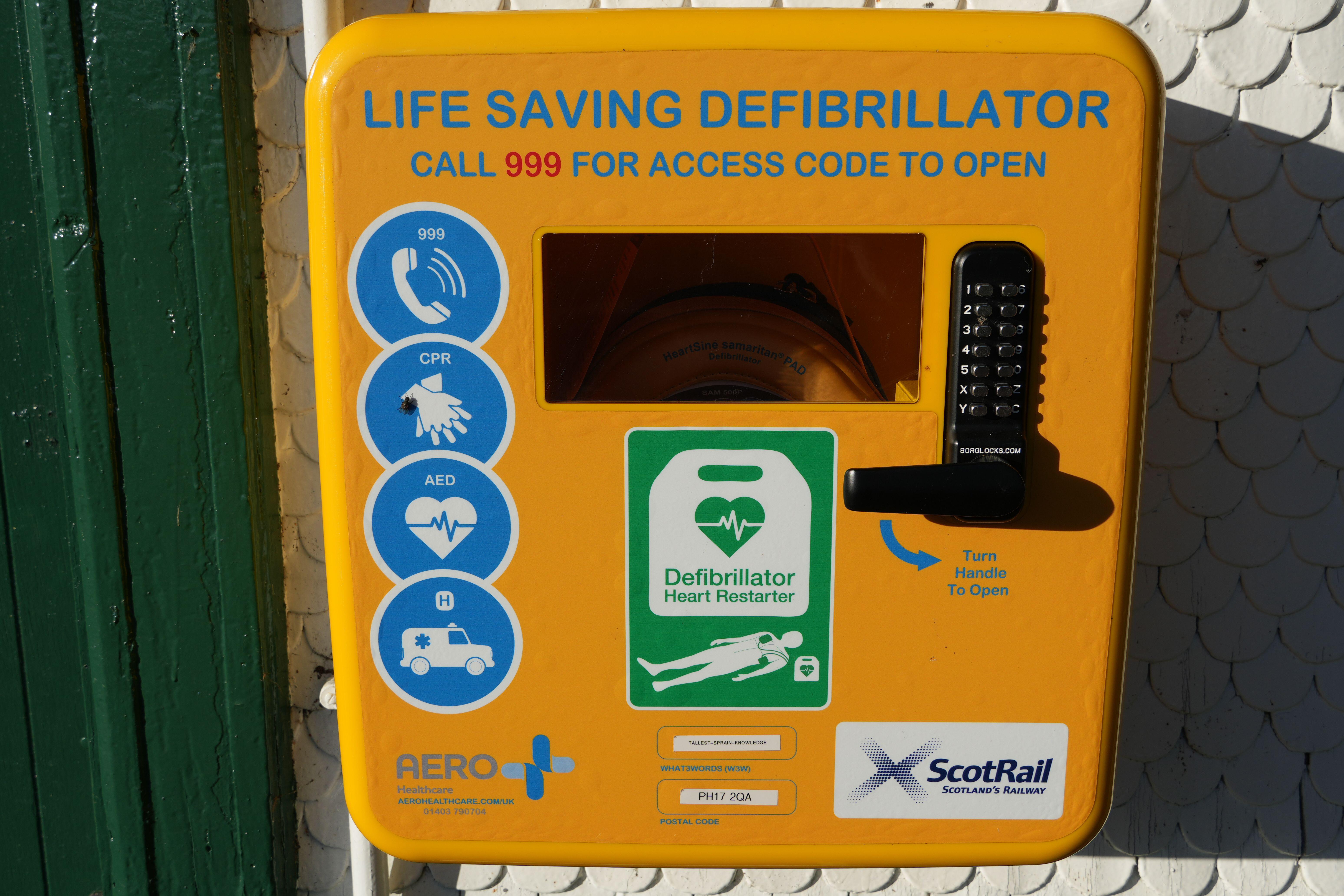 A defibrillator attached to the side of a building