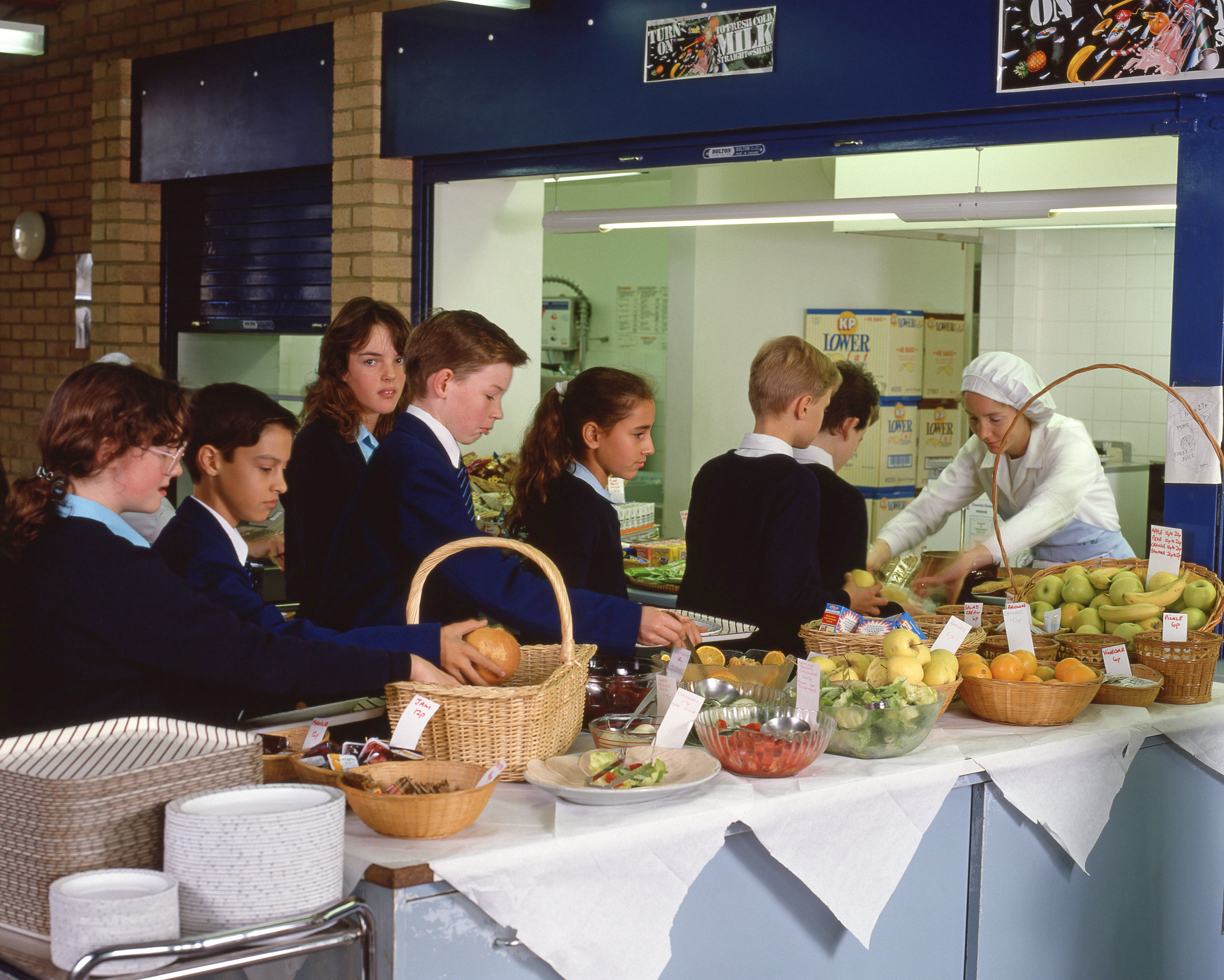 Children queuing up for food at a secondary school canteen in Surrey