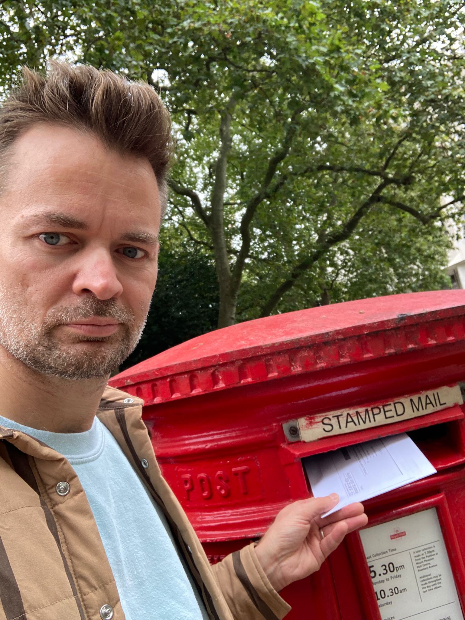 A man posting his ballot paper