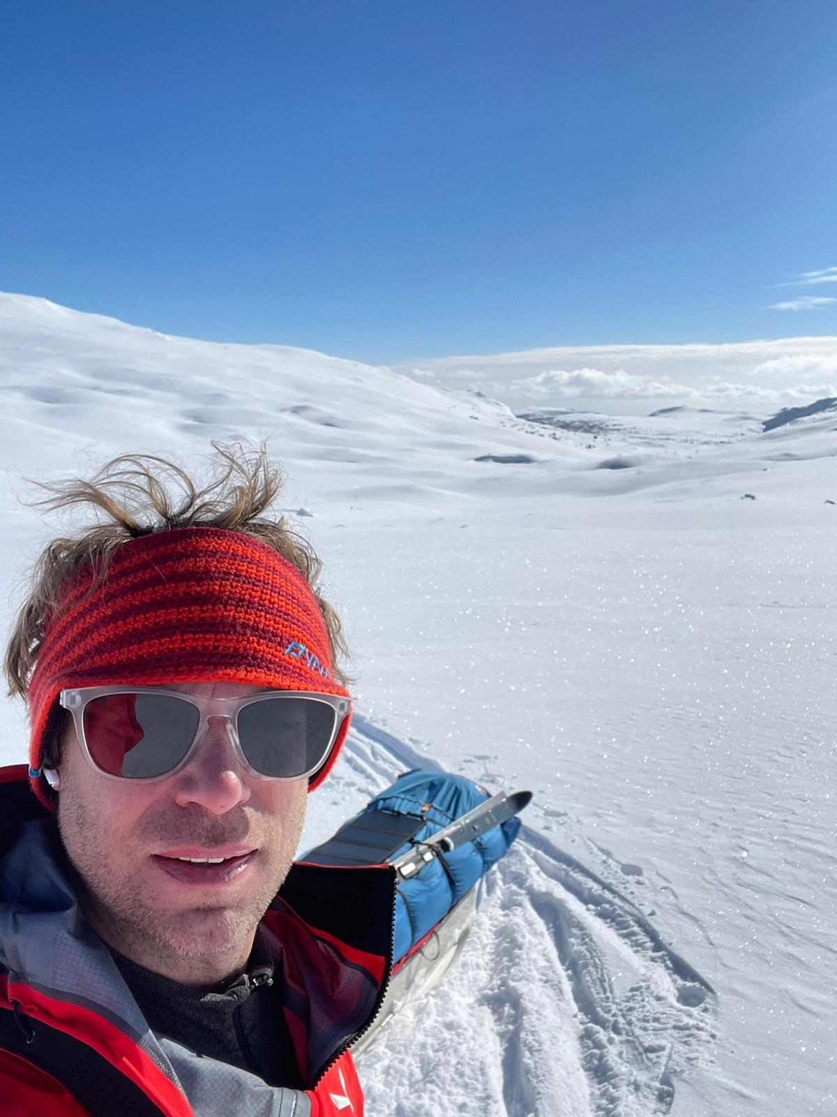 A man standing in front of snow