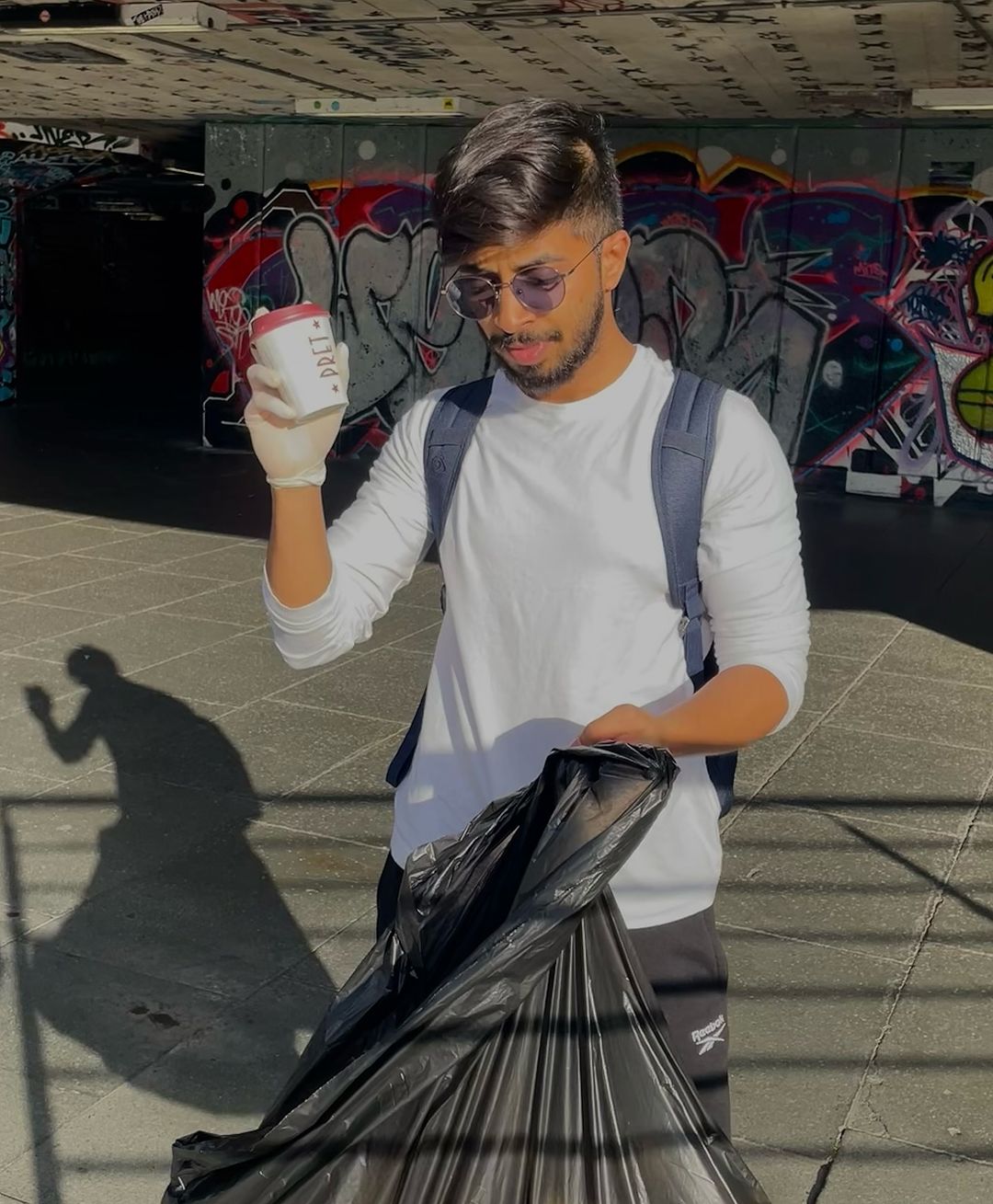 A man picking up litter in London