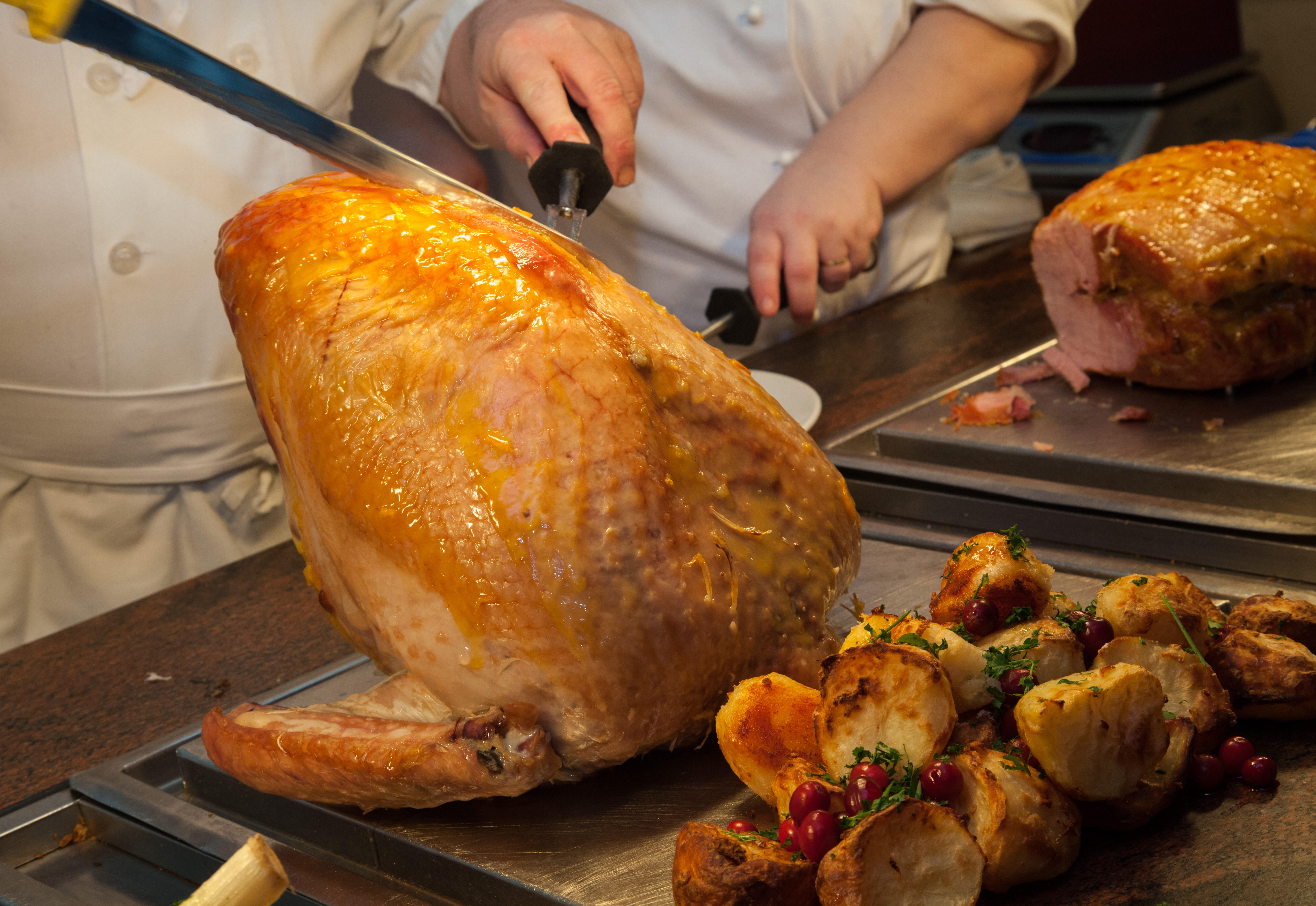 A chef carving a turkey