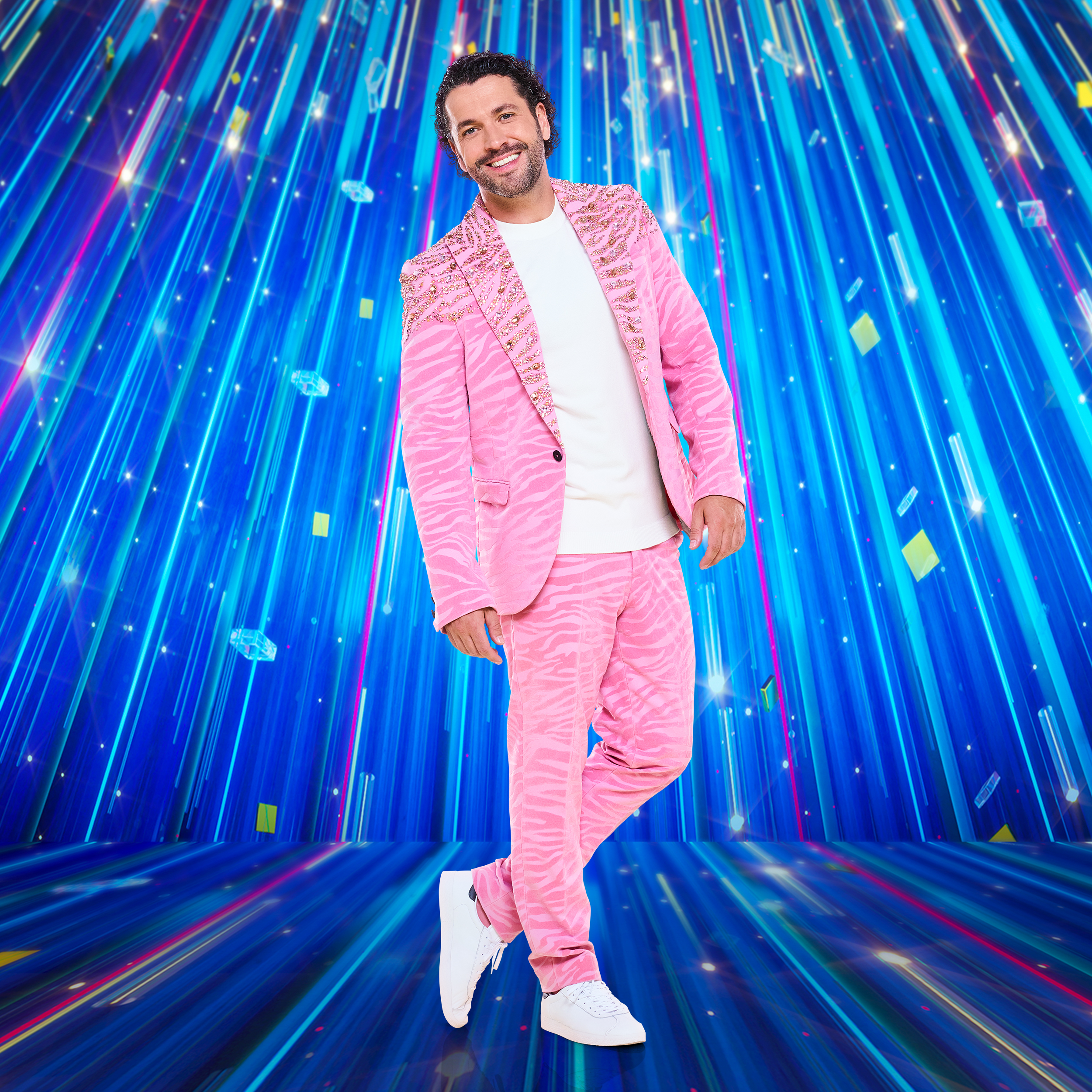 Shayne Ward wearing a pink suit jacket and trousers and white T-shirt in a promotional image for Strictly Come Dancing