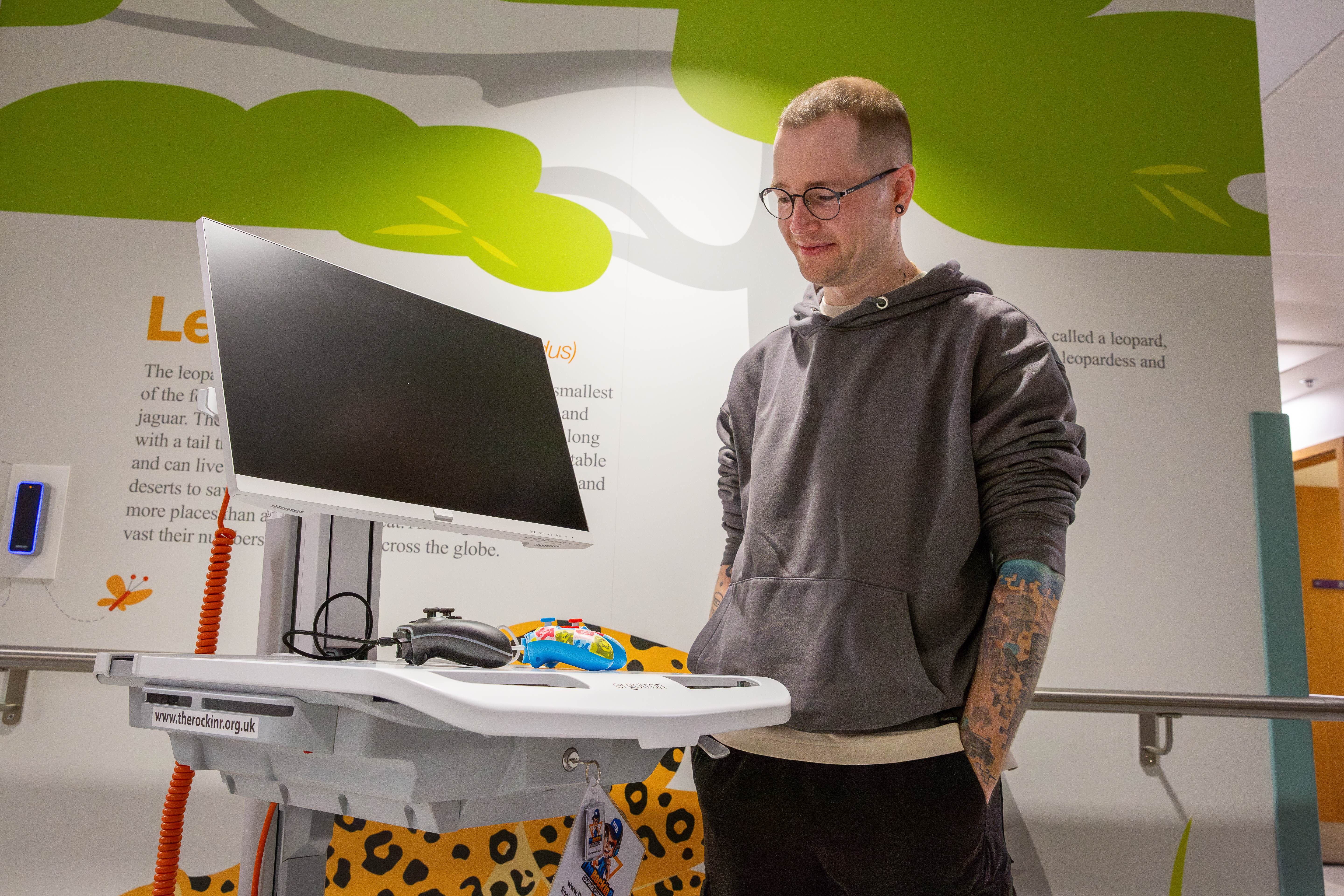 YouTuber DanTDM looking at a gaming cart which was funded by his donation to Great Ormond Street Hospital