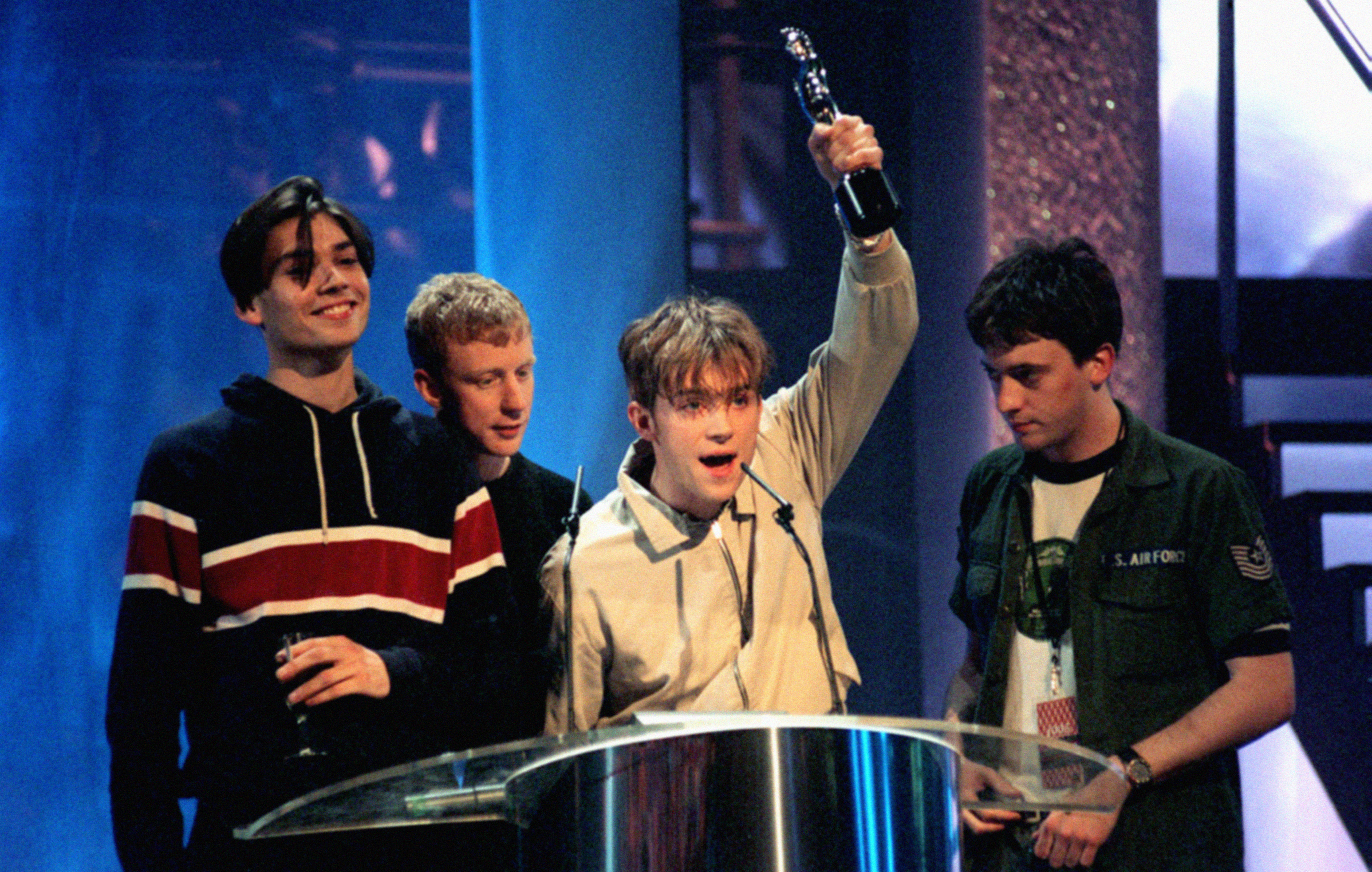 Blur winning a Brit Award for Top British Artists of the year 1995.