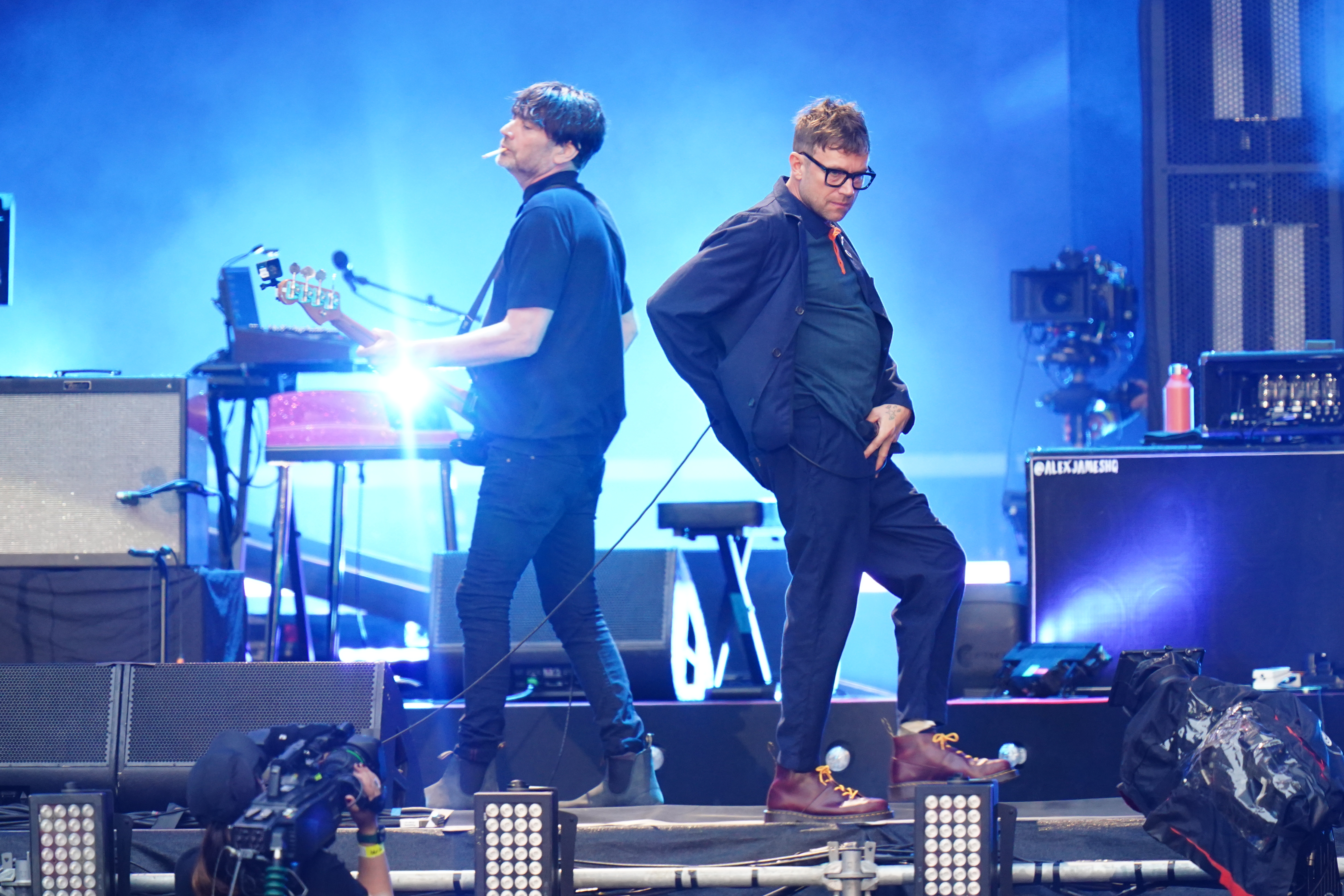 Alex James (L) and Damon Albarn of Blur performing on stage at Wembley Stadium in London in 2023.