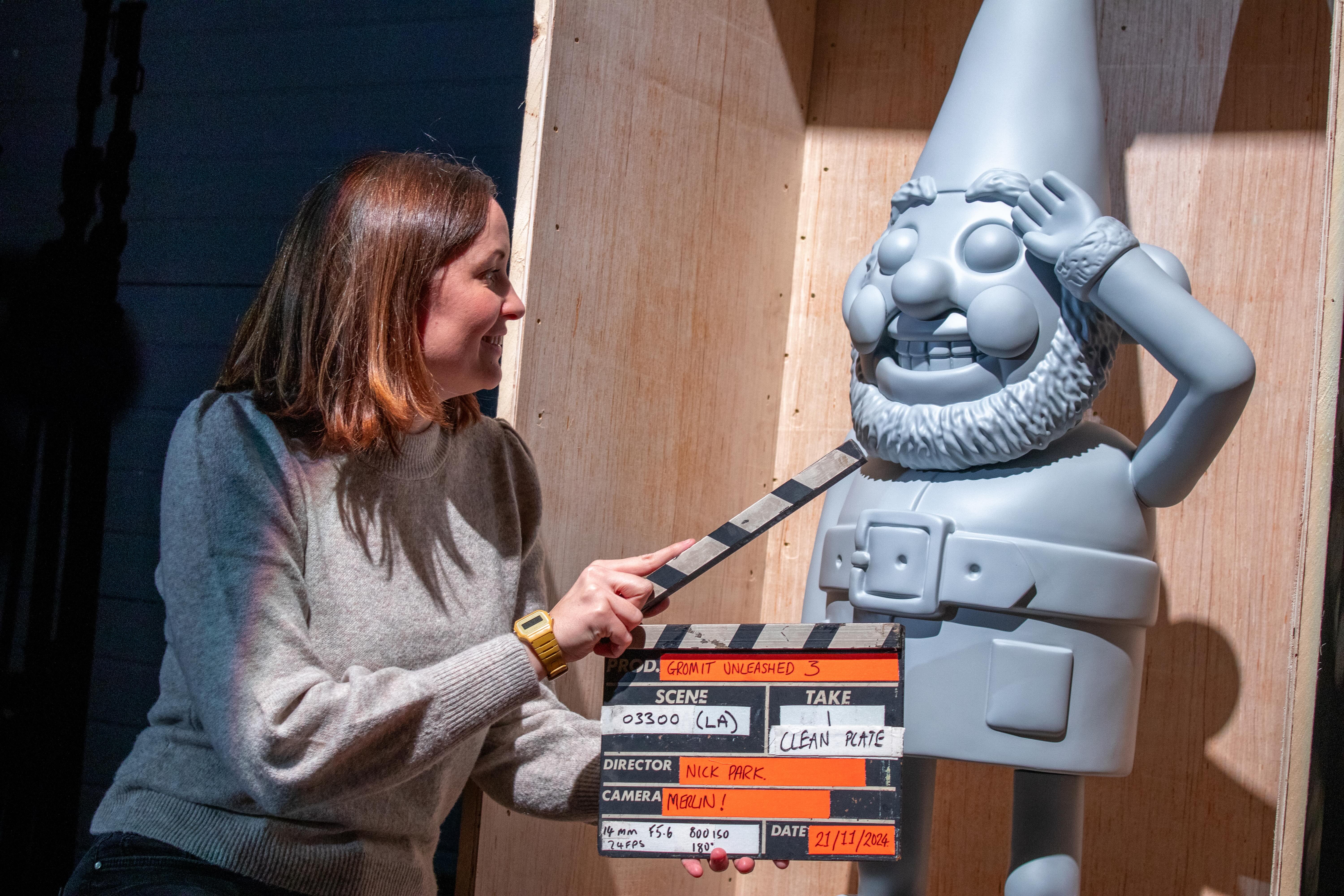 Anna Hitchcock, from charity The Grand Appeal, with smart gnome Norbot (Simon Boddy/The Grand Appeal/PA)