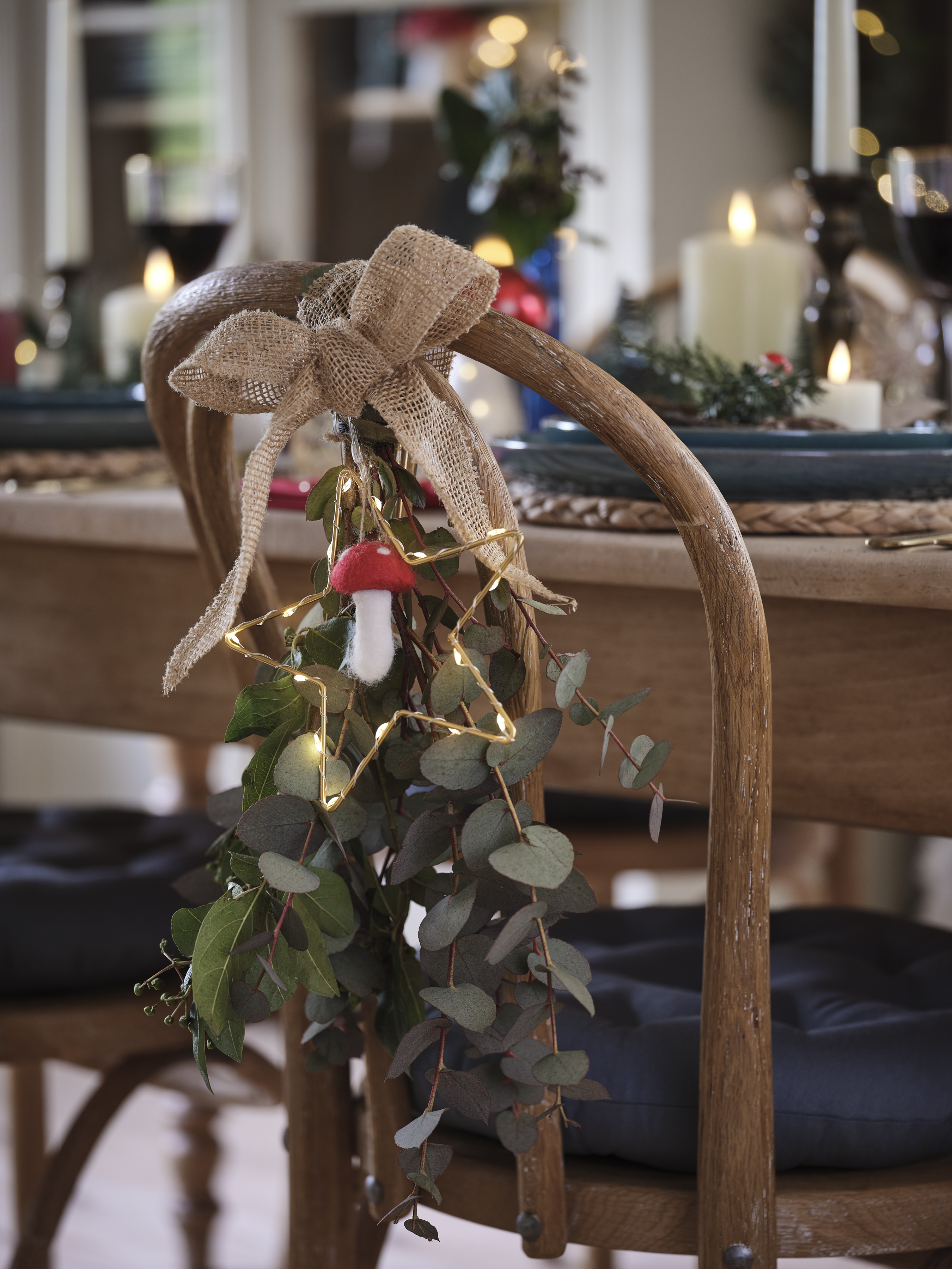 Christmas dining chair decoration with foliage (Lights4fun/Oliver Perrott/PA)