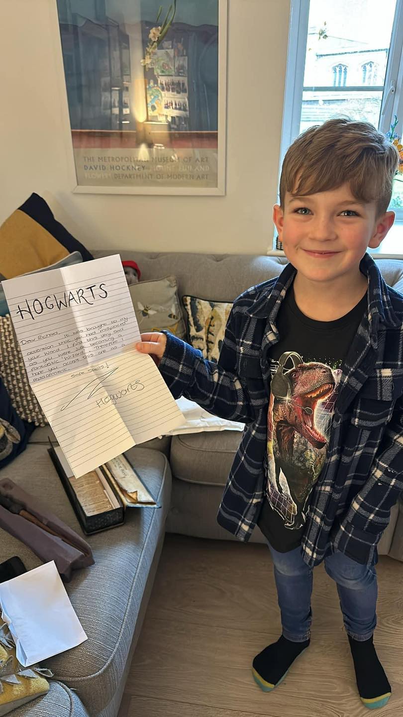 Boy holding letter in his hand 