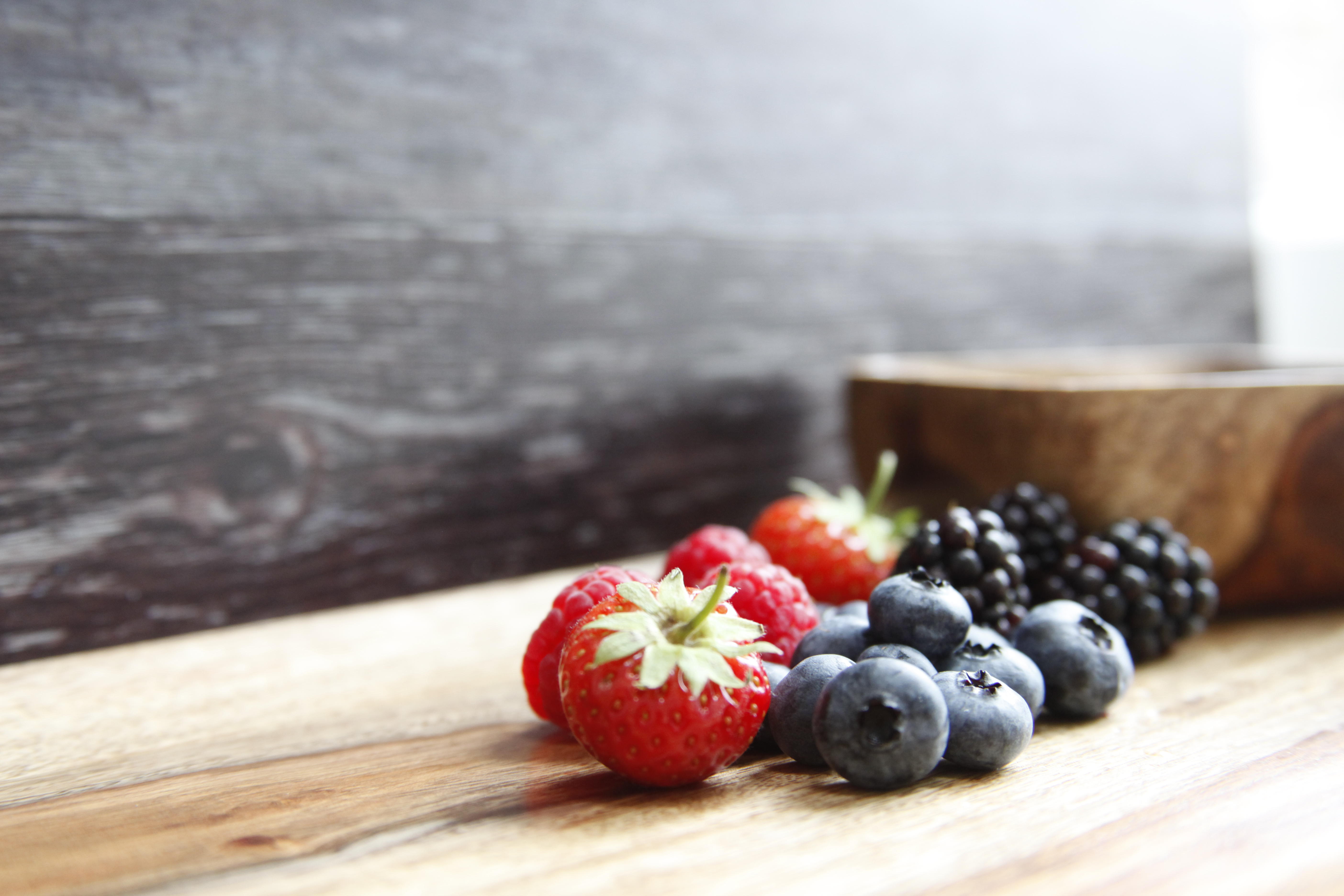 A selection of berries on a wooden table