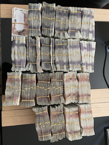 A close up of bundles of cash seized during the Jersey investigation.