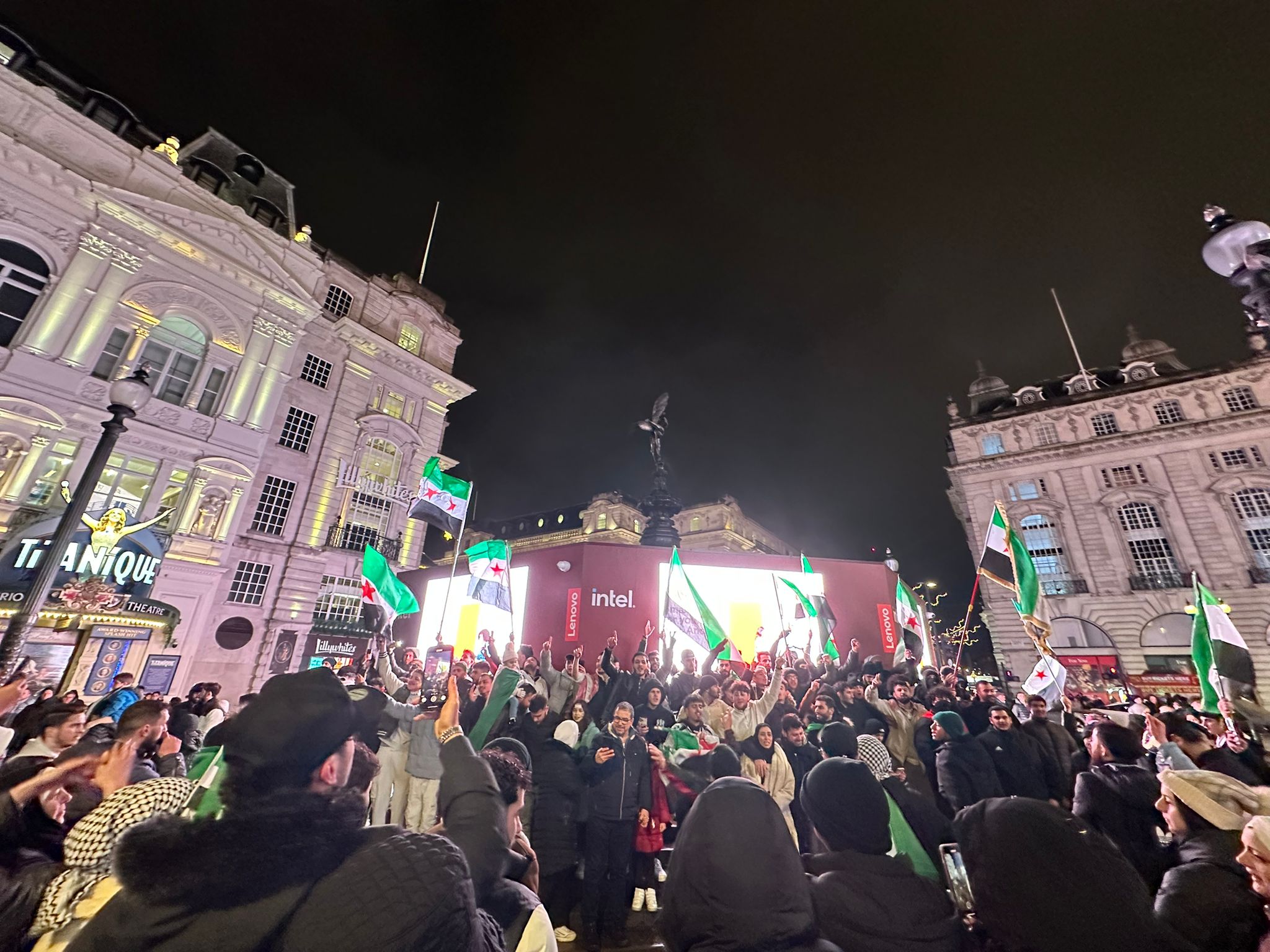 A crowd of people with flags