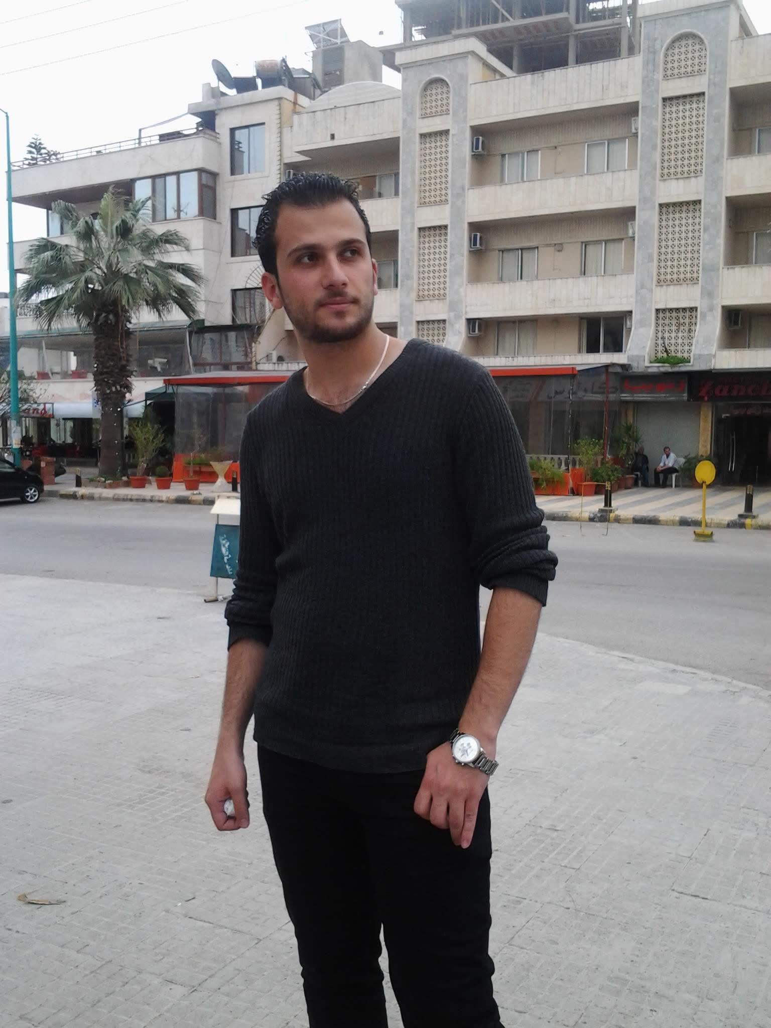 A man standing in front of a building