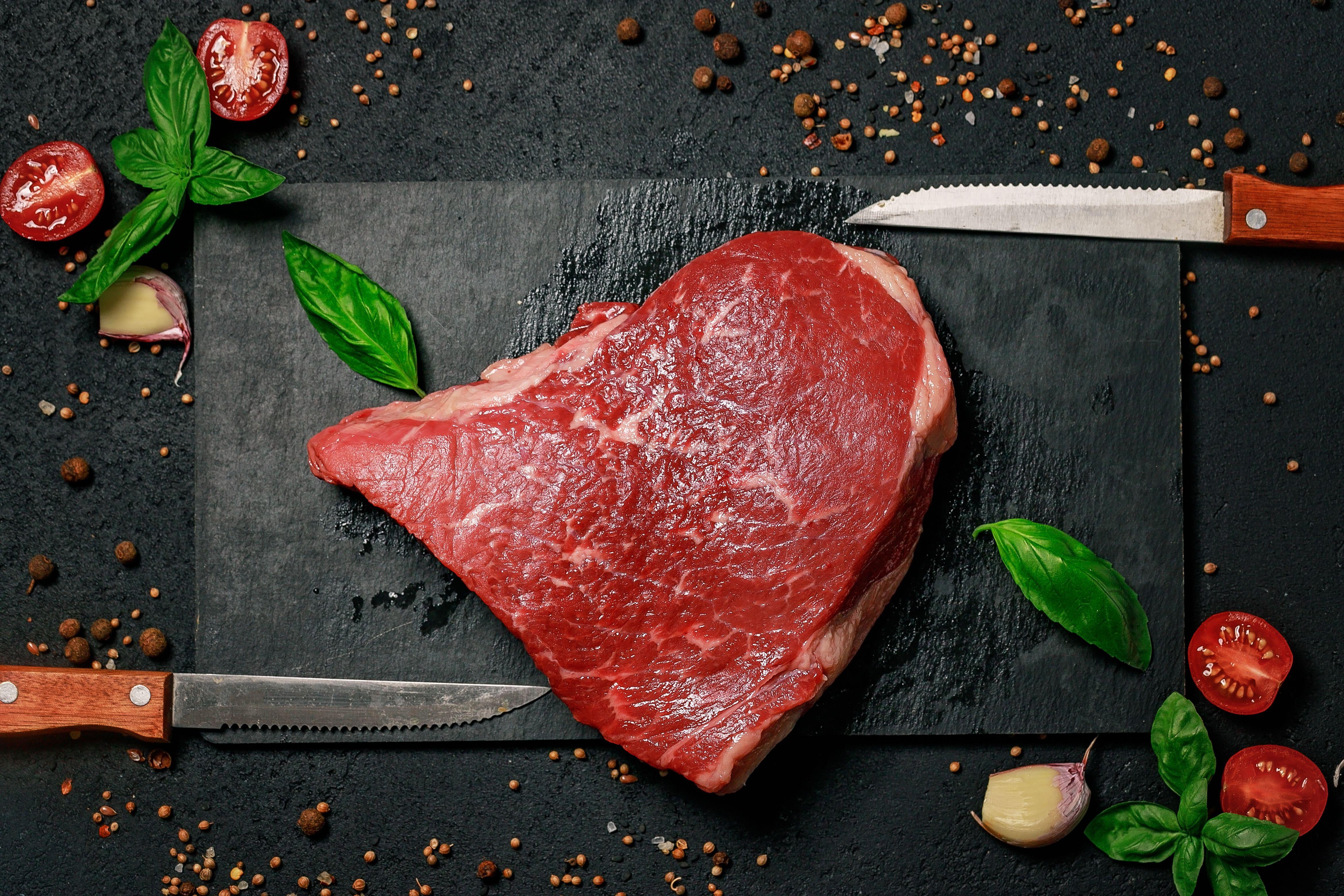  Raw beef steak on a stone cutting board