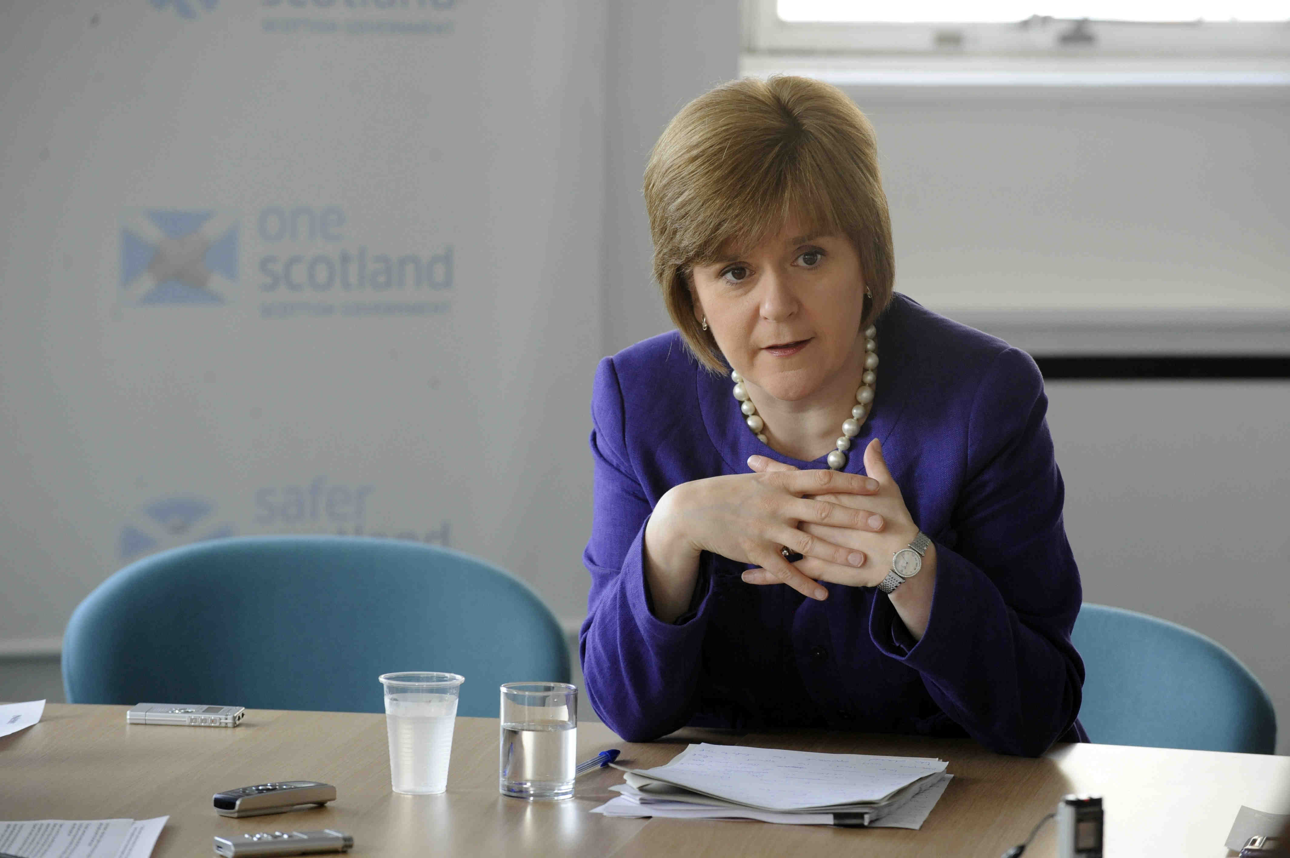 Nicola Sturgeon, pictured in 2012, speaking while seated at a table